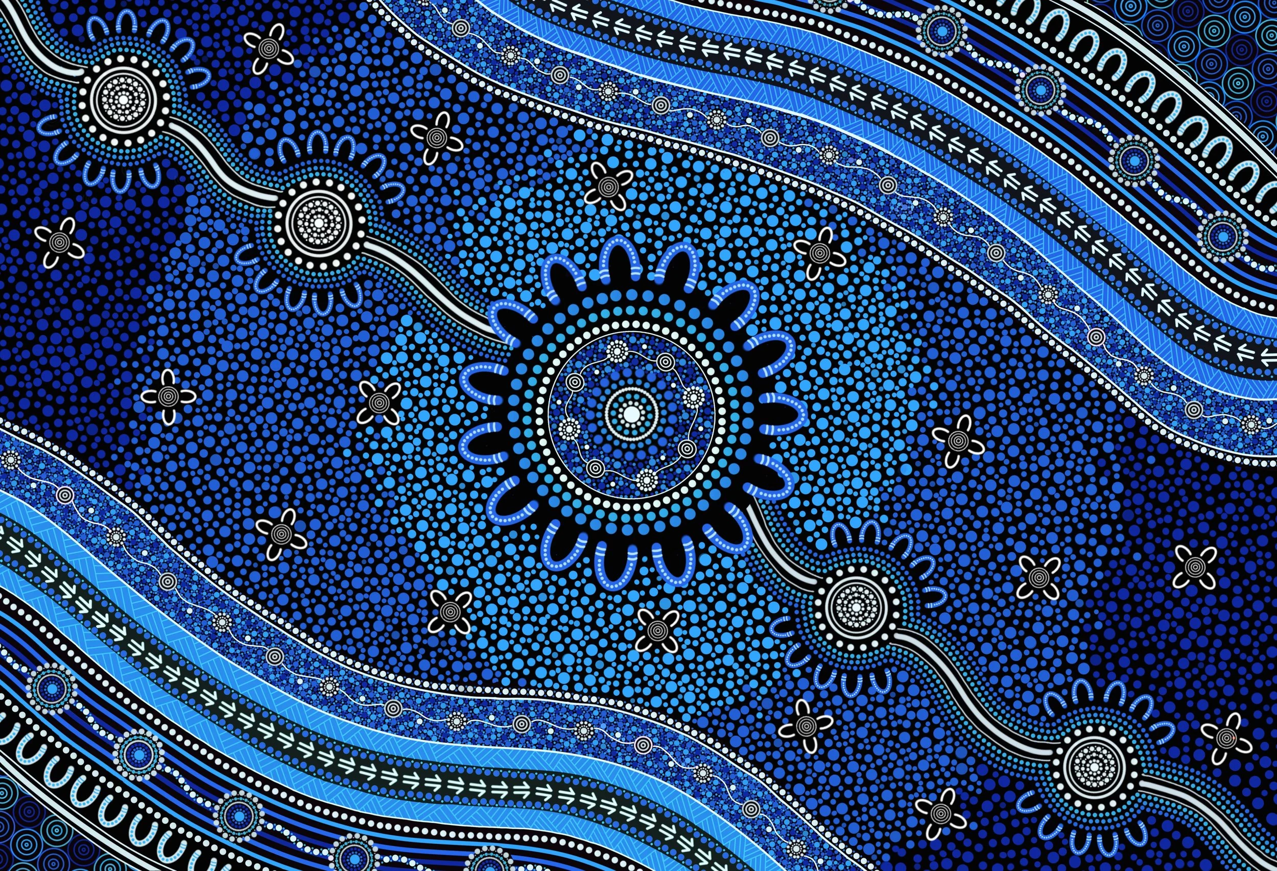 A colorful Aboriginal-style painted dot art with blue, black, and white patterns, circular motifs, and flowing lines.