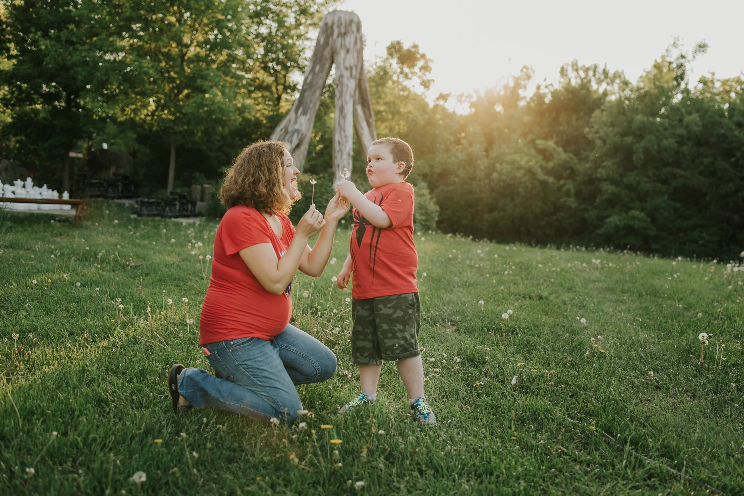boy blowing dandelion flower seeds with mommy - Minneapolis Kid Photographer