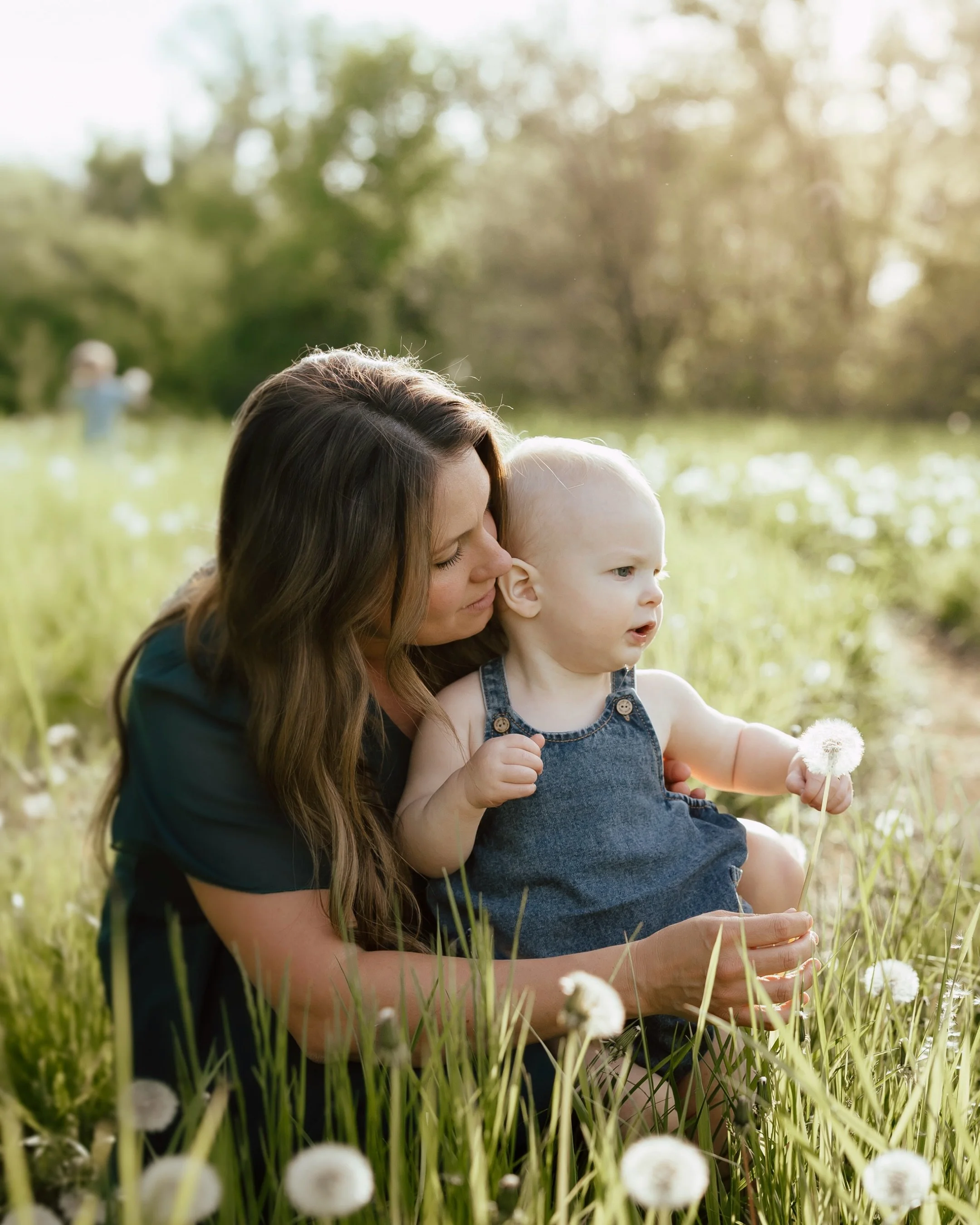 My Minnesota milestone newborn sessions incorporate your whole family&mdash;including barn cats! These sessions are all about capturing your first year together, not just your baby! Your transformation as parents, your older children becoming sibling