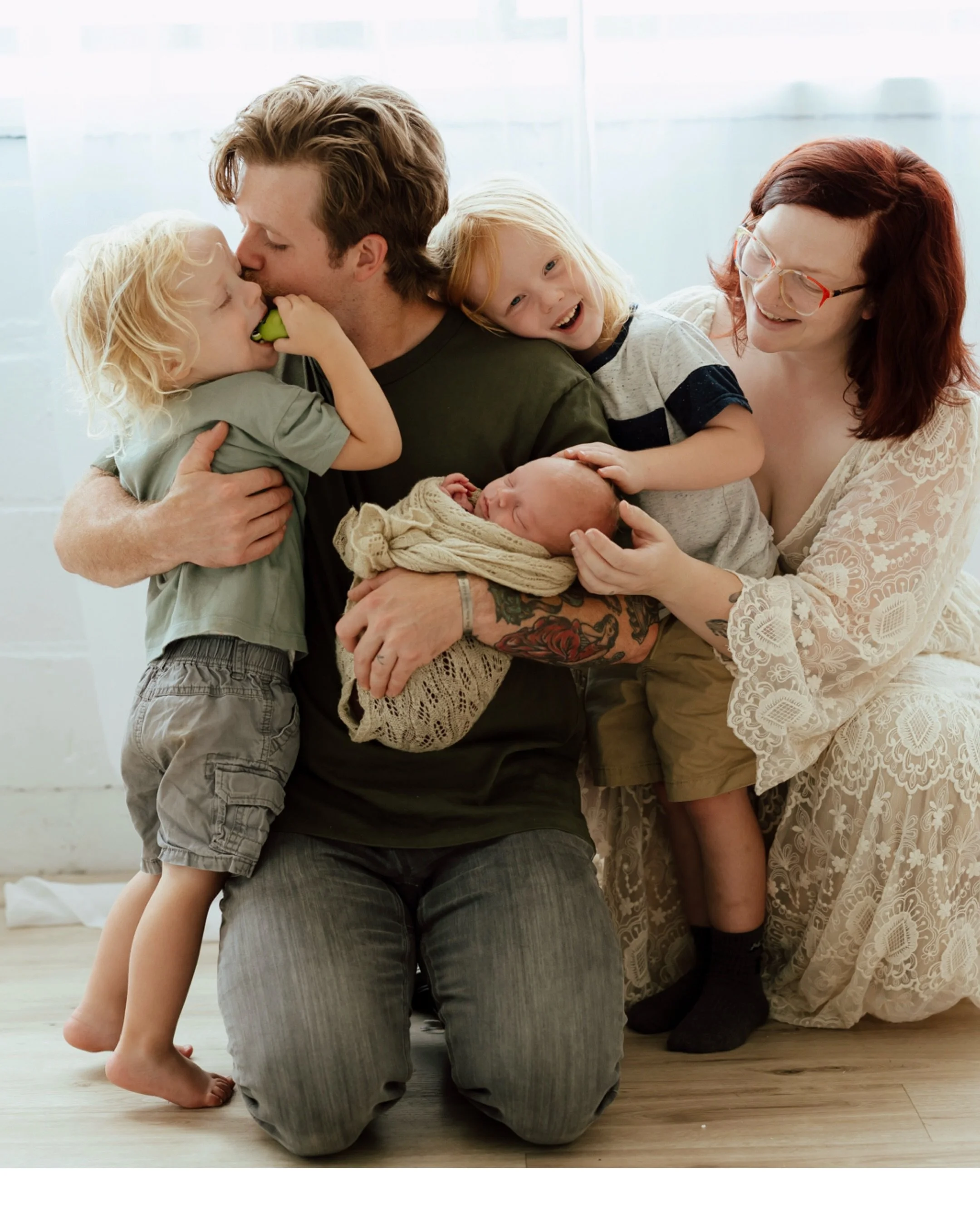 Newborn photo sessions are an opportunity to just be a family with all of the chaos that entails.  I have intentionally designed my studio to be a place where little ones can play, snacks can be had, and moments to feed or change baby are expected.  