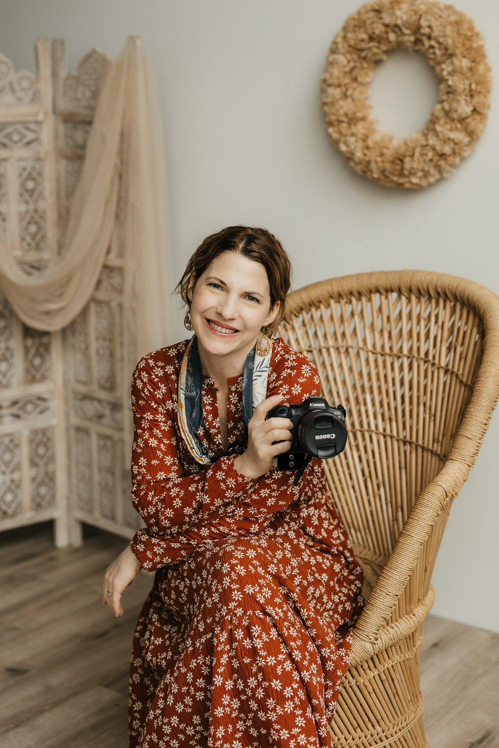 ann marie of amg photography is sitting in her minneapolis studio