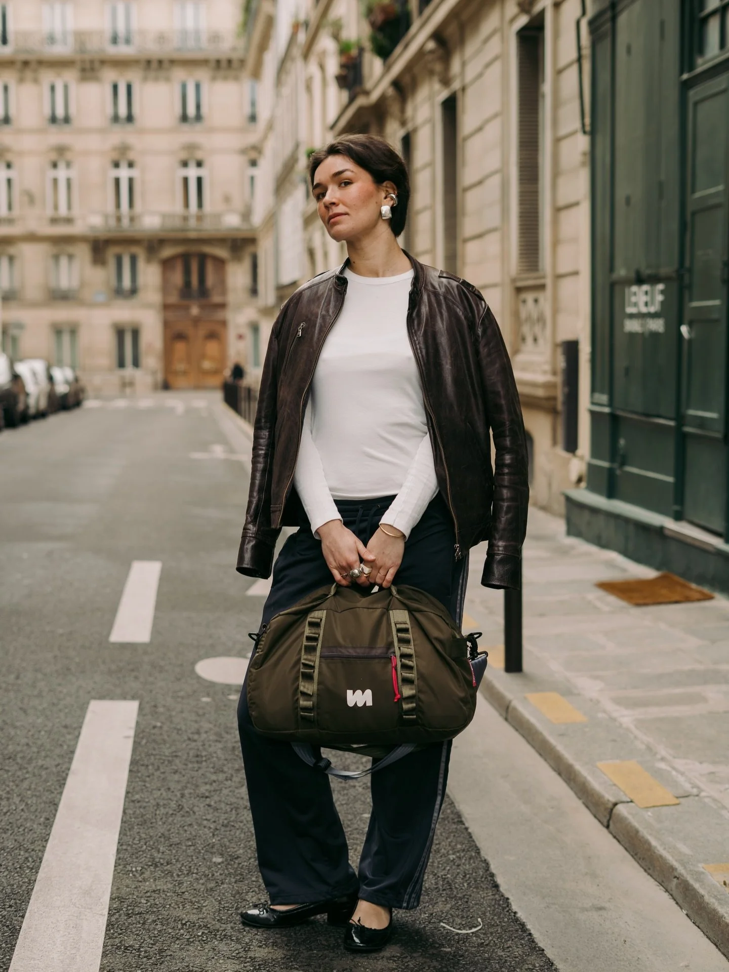 Erika wearing our duffle bag, the DB-211 [M] in khaki. 
Available online, and in our workshop.