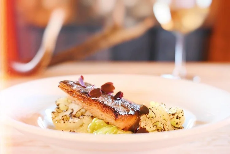 Nordic dessert with edible flowers and chocolate sauce at Dovrefjell Lodge restaurant, Norway