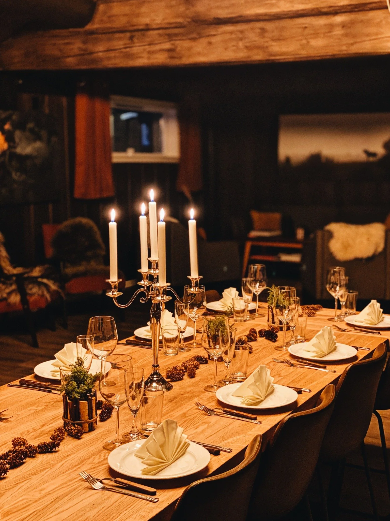 Cosy private dining lounge with candlelight at Dovrefjell Lodge restaurant, near Dombås Norway