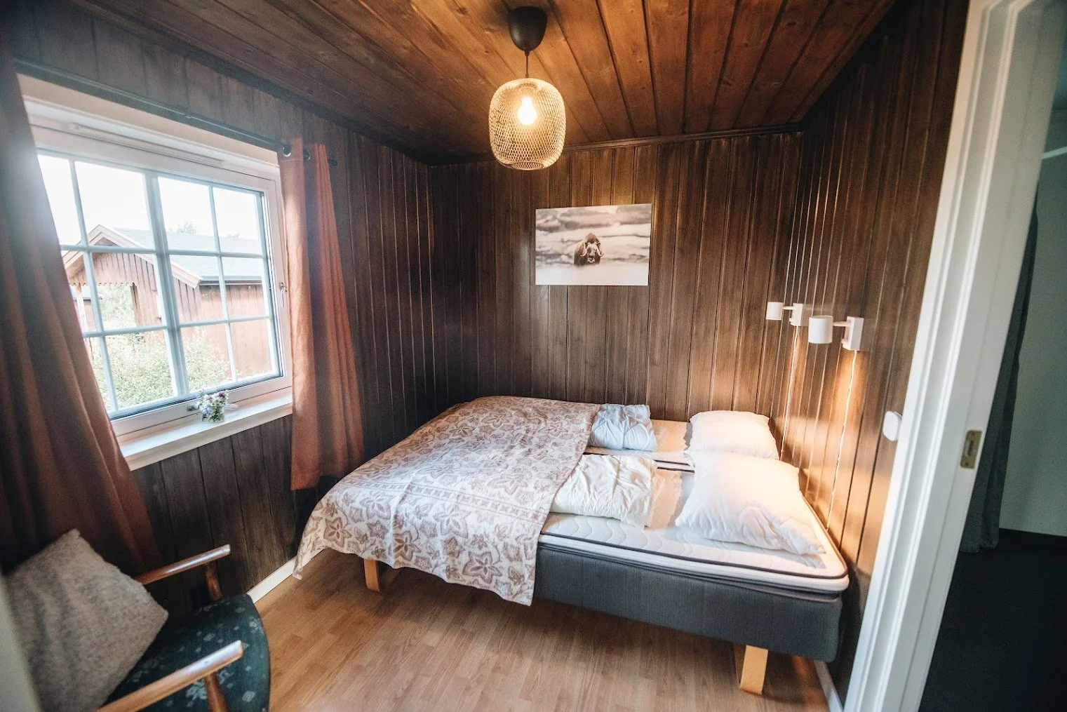 Traditional Norwegian mountain cabin bedroom at Dovrefjell Lodge – cosy self-catering accommodation near Dombås, Norway
