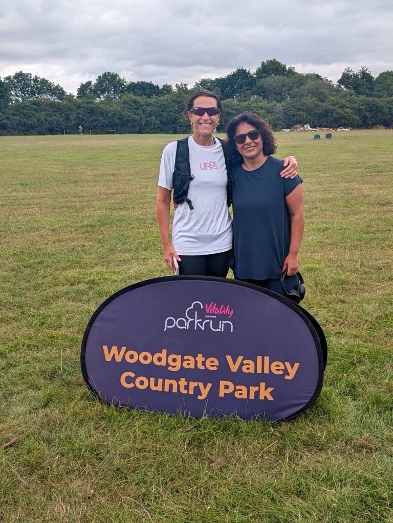 Two smiling women after a run at Woodgate Valley Country Park