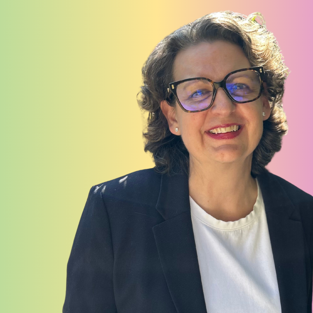 An image of a smiling woman against a colourful background. She is the coordinator of the UK Charity for TNBC's Patient Advisory Panel.