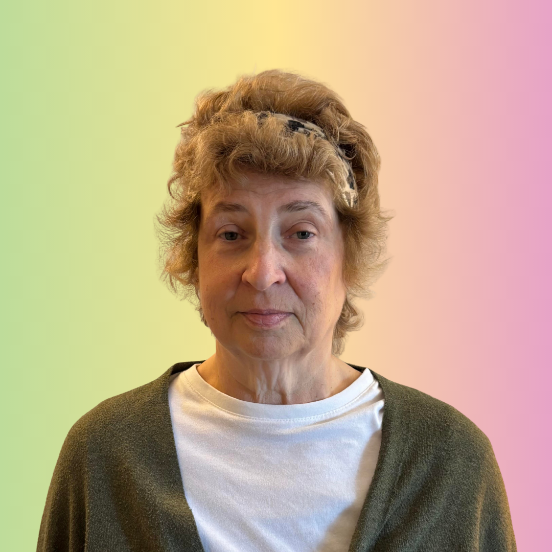 An image of a smiling woman against a colourful background. She is the support partner of the UK Charity for TNBC's Patient Advisory Panel.