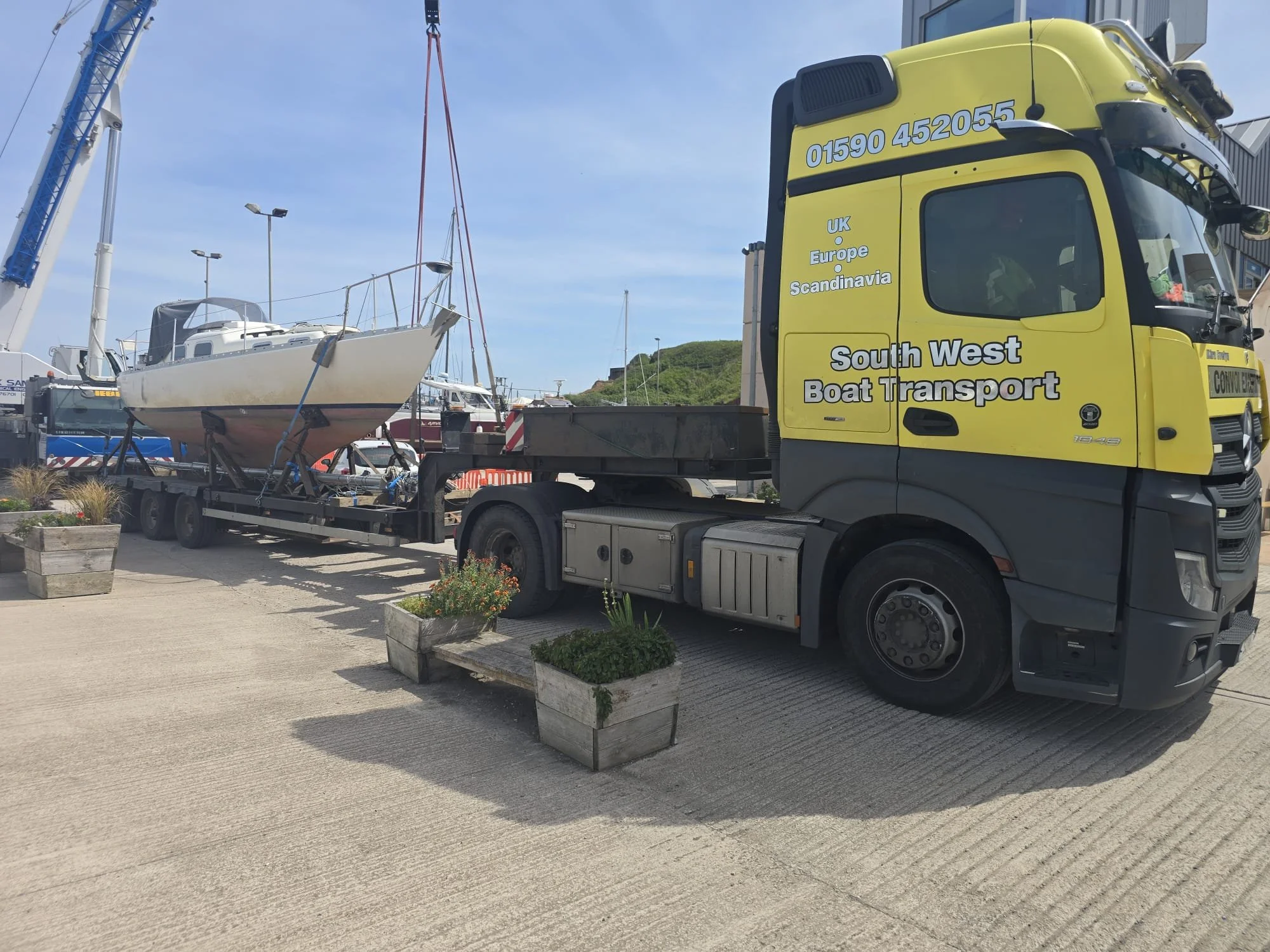 sailboat on a low loader truck