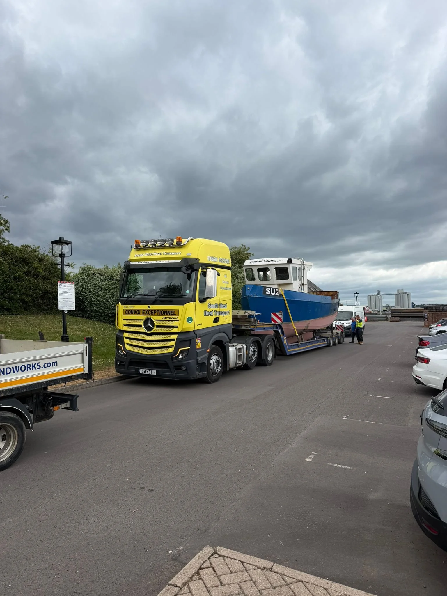 Commercial steel fishing boat on a low loader transporter