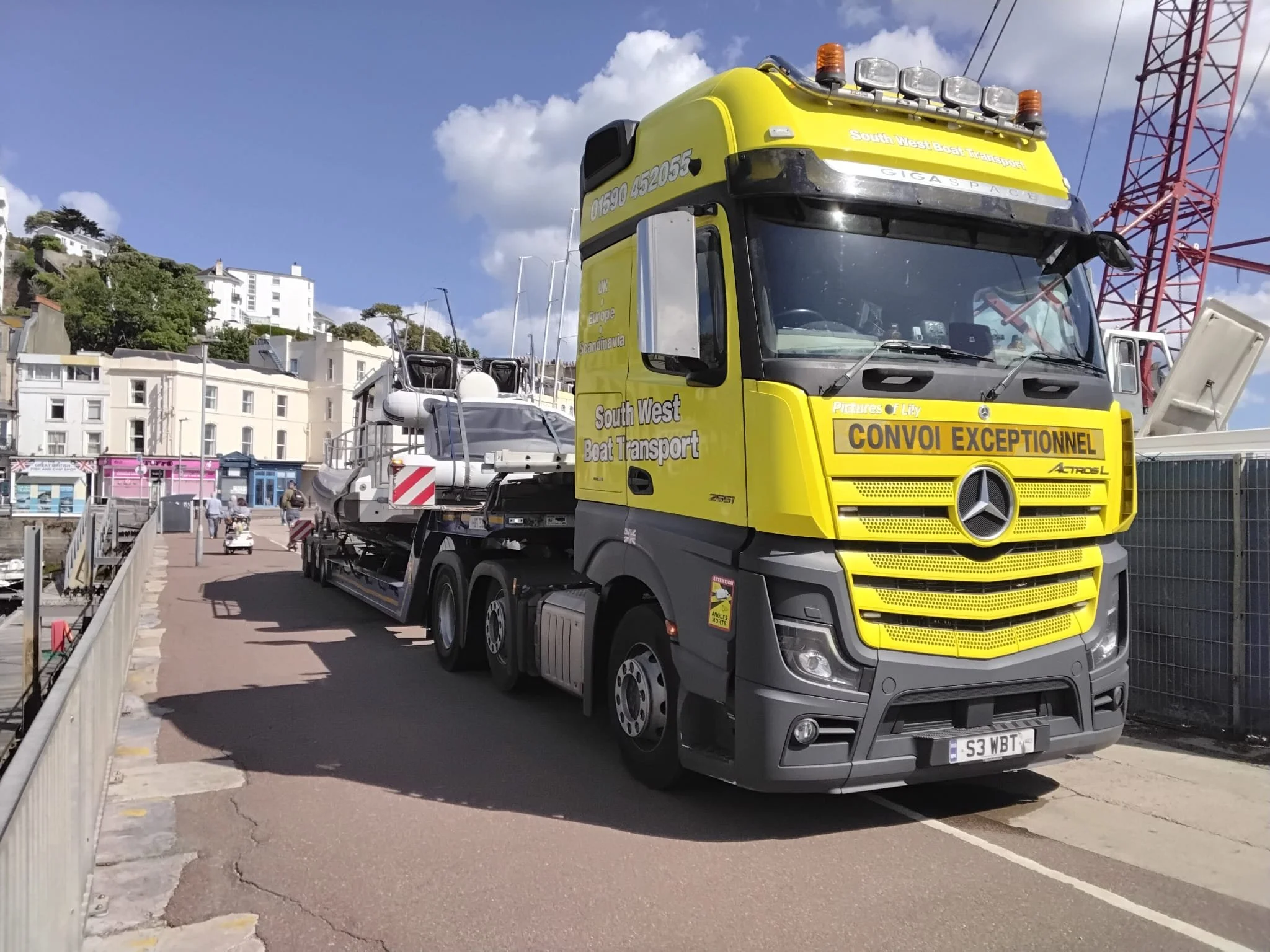 Motor boat on a low loader truck