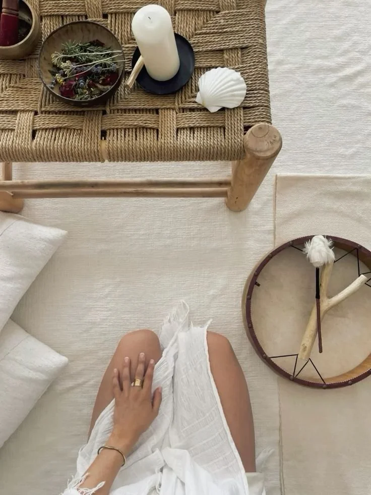 Woman seated in meditation with sound healing tools for voice ritual practice