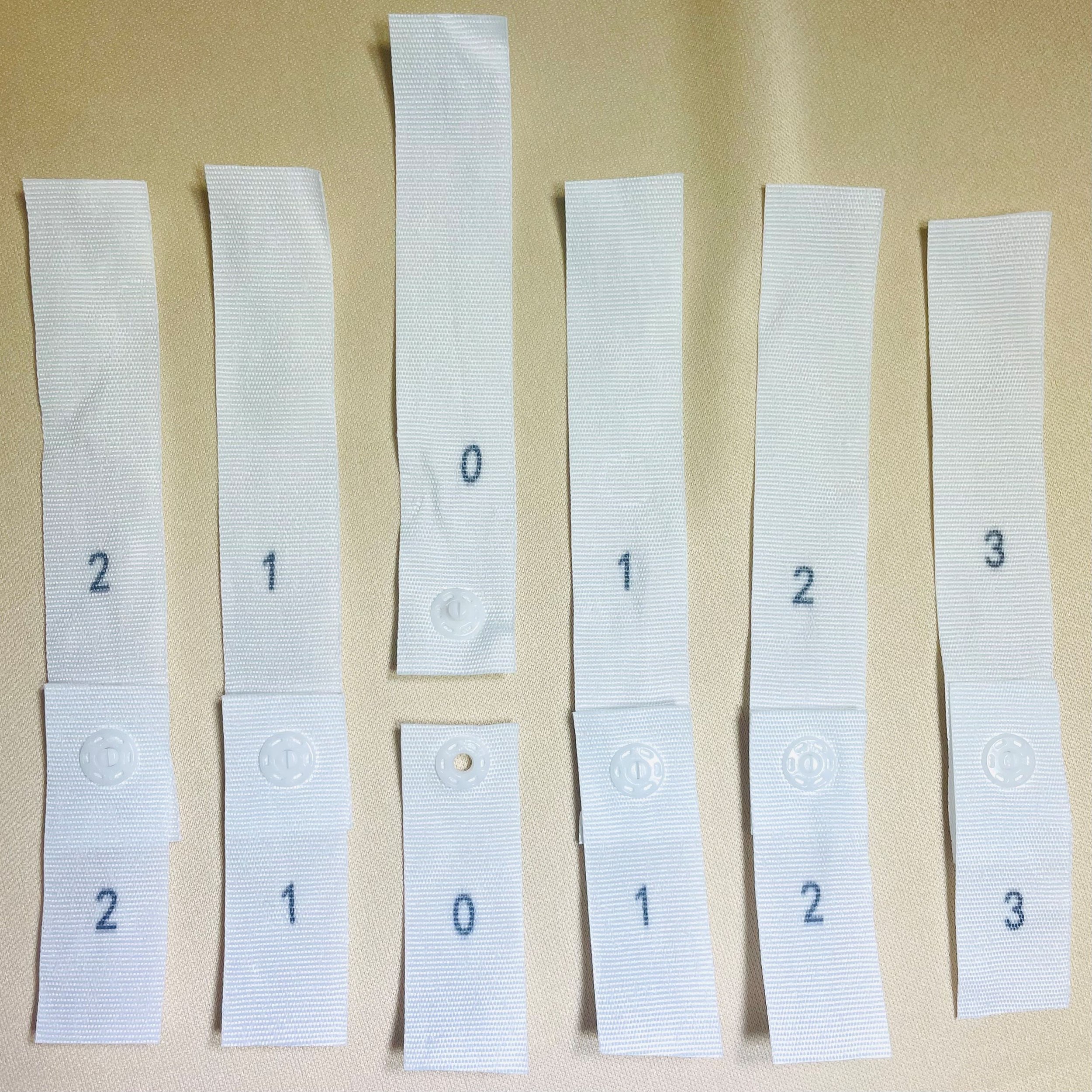 photo of numbered bustle snap straps