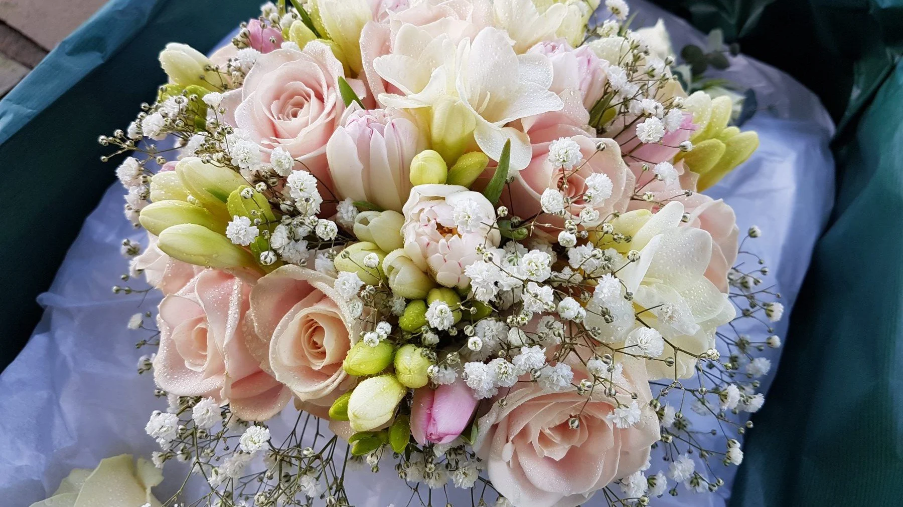 Bouquet of pale pink, yellow and white flowers