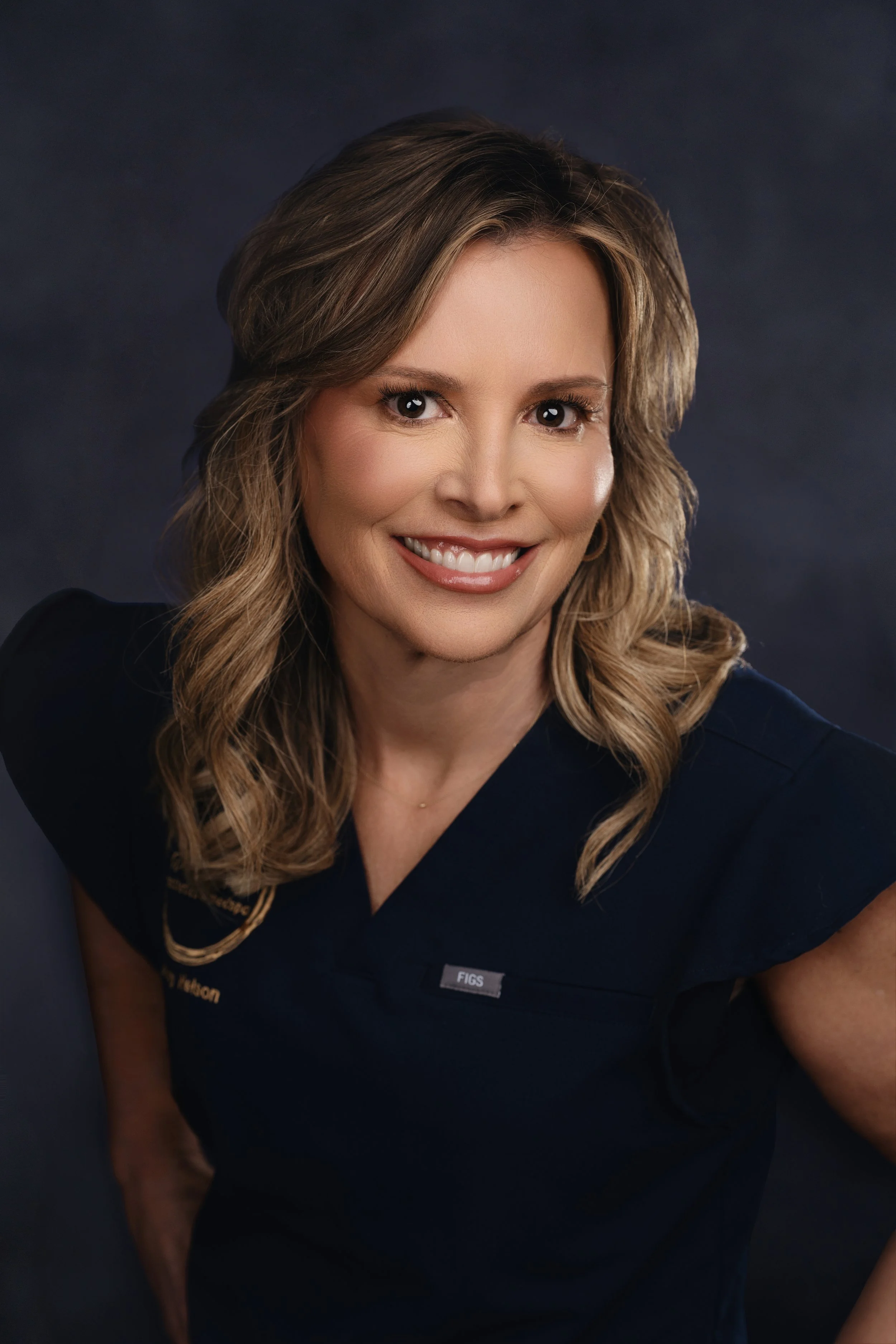 Jenny Nelson front desk team member at a.dore aesthetics & medspa assisting patients and scheduling appointments