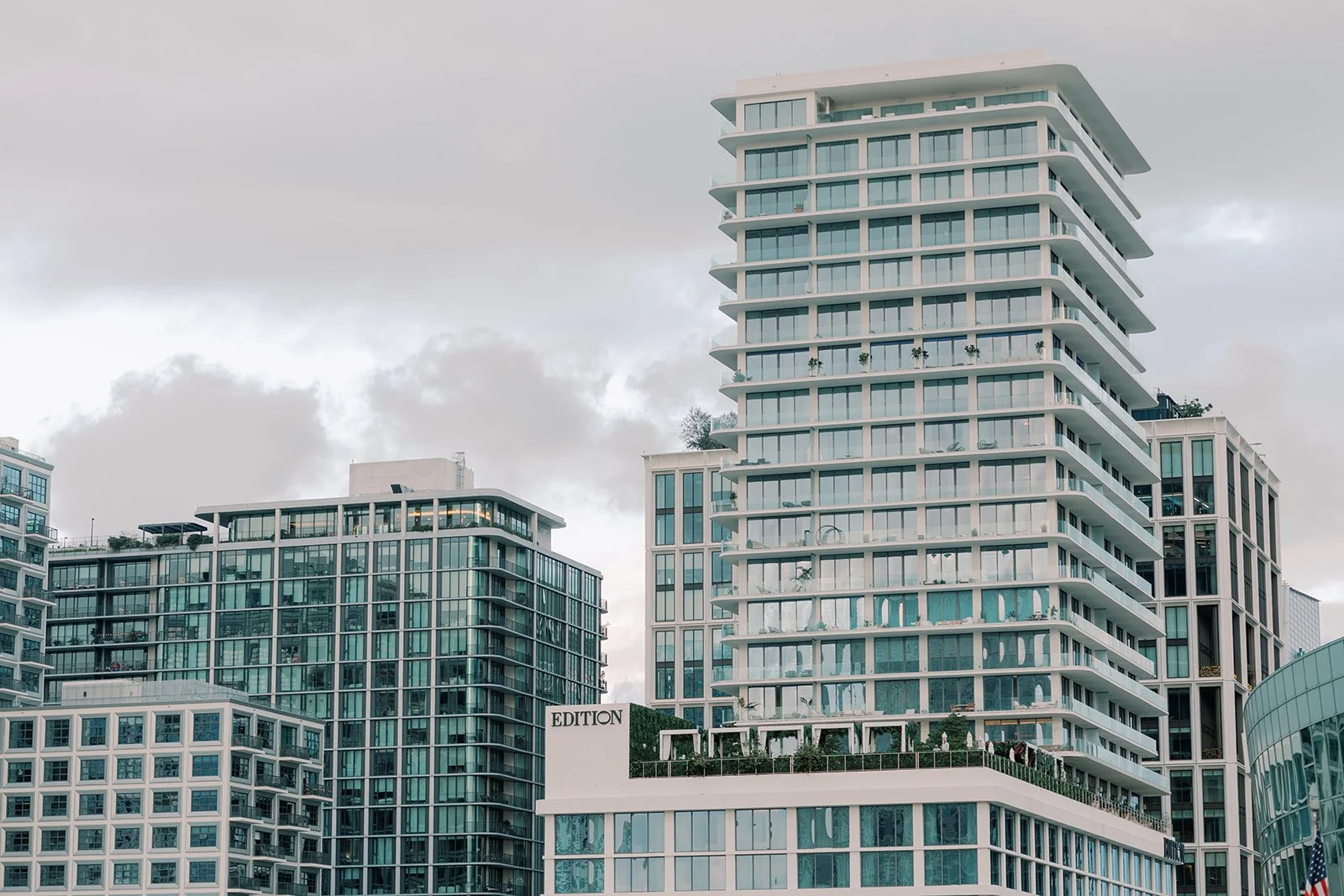 Modern condominium building representing Self-Directed IRA real estate investing, lending versus owning comparison.