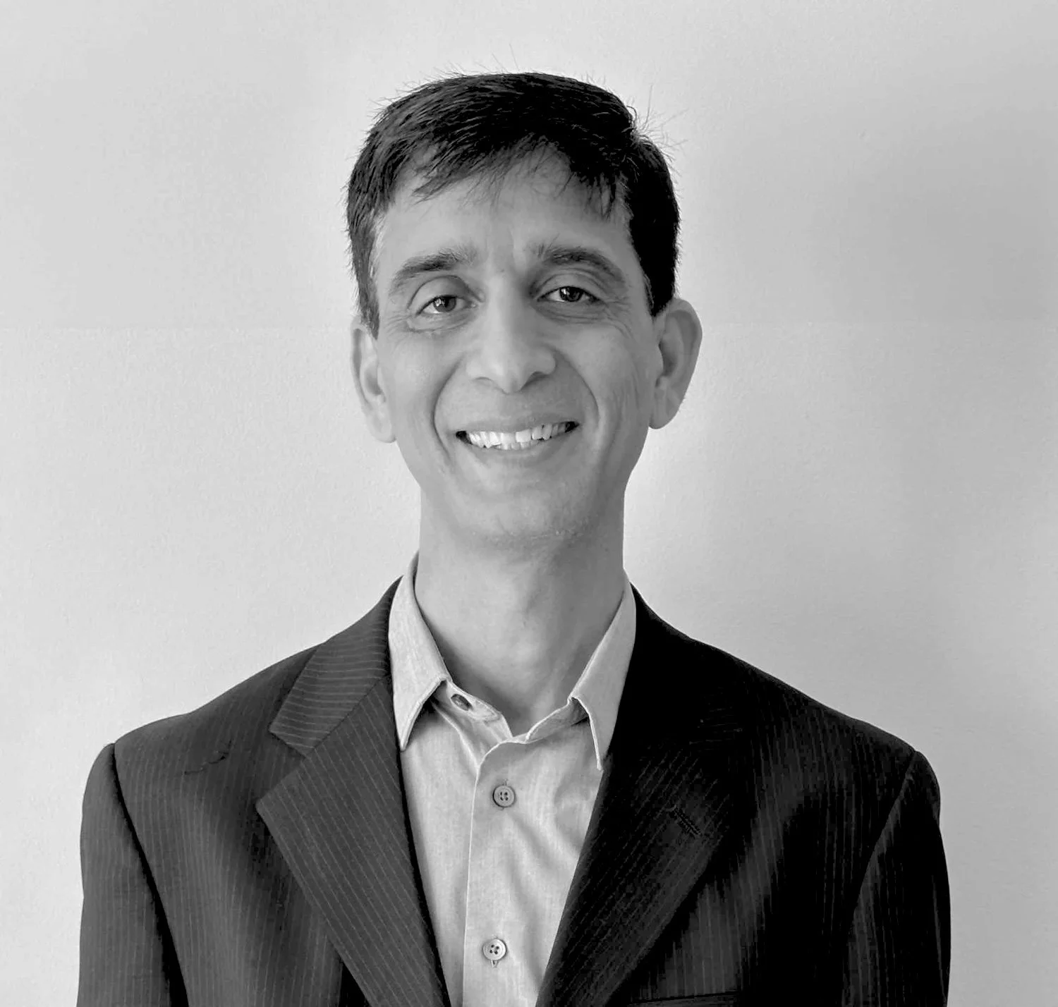 black and white headshot businessman in suit