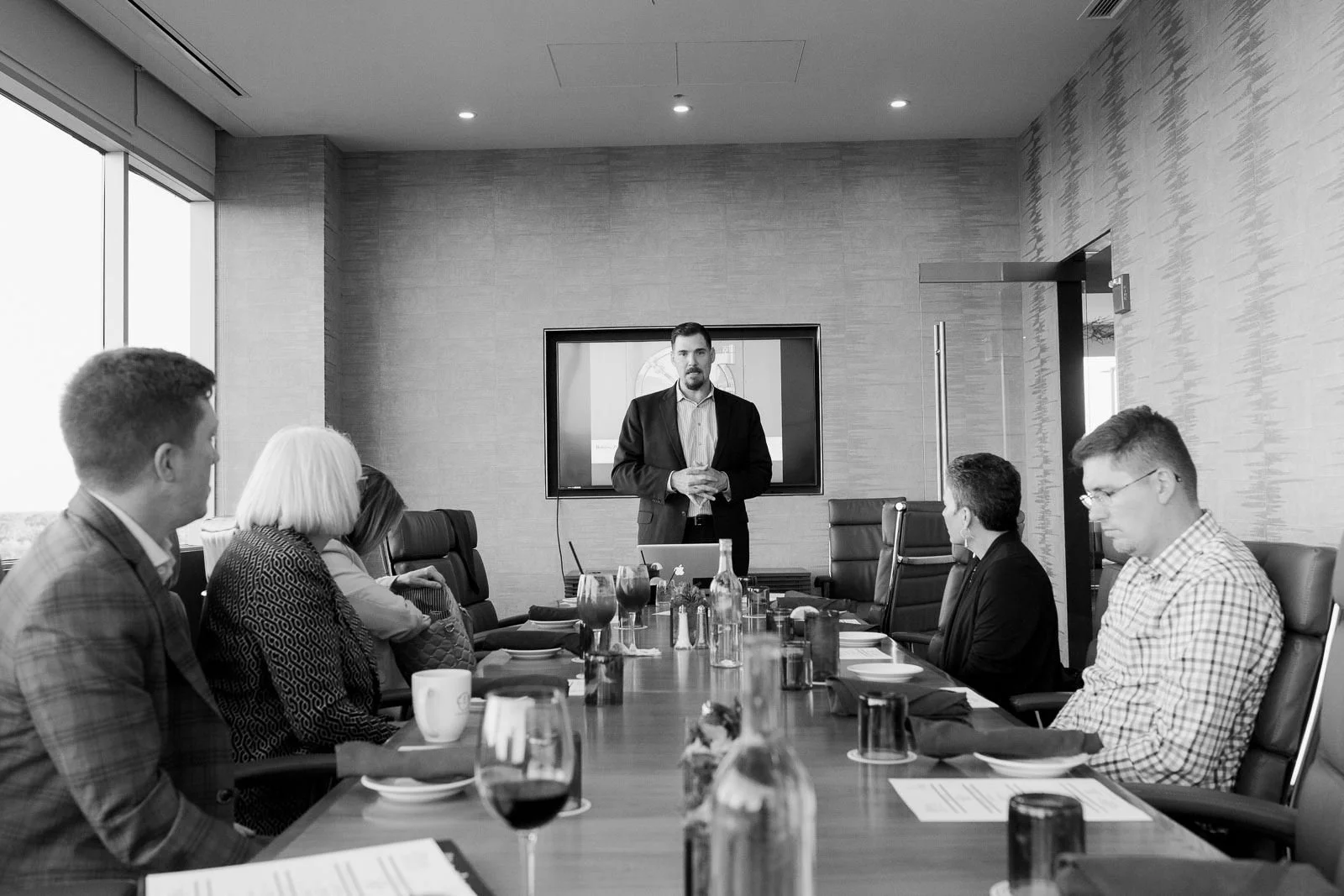 Boardroom discussion representing accredited investor risk control techniques and strategic capital preservation