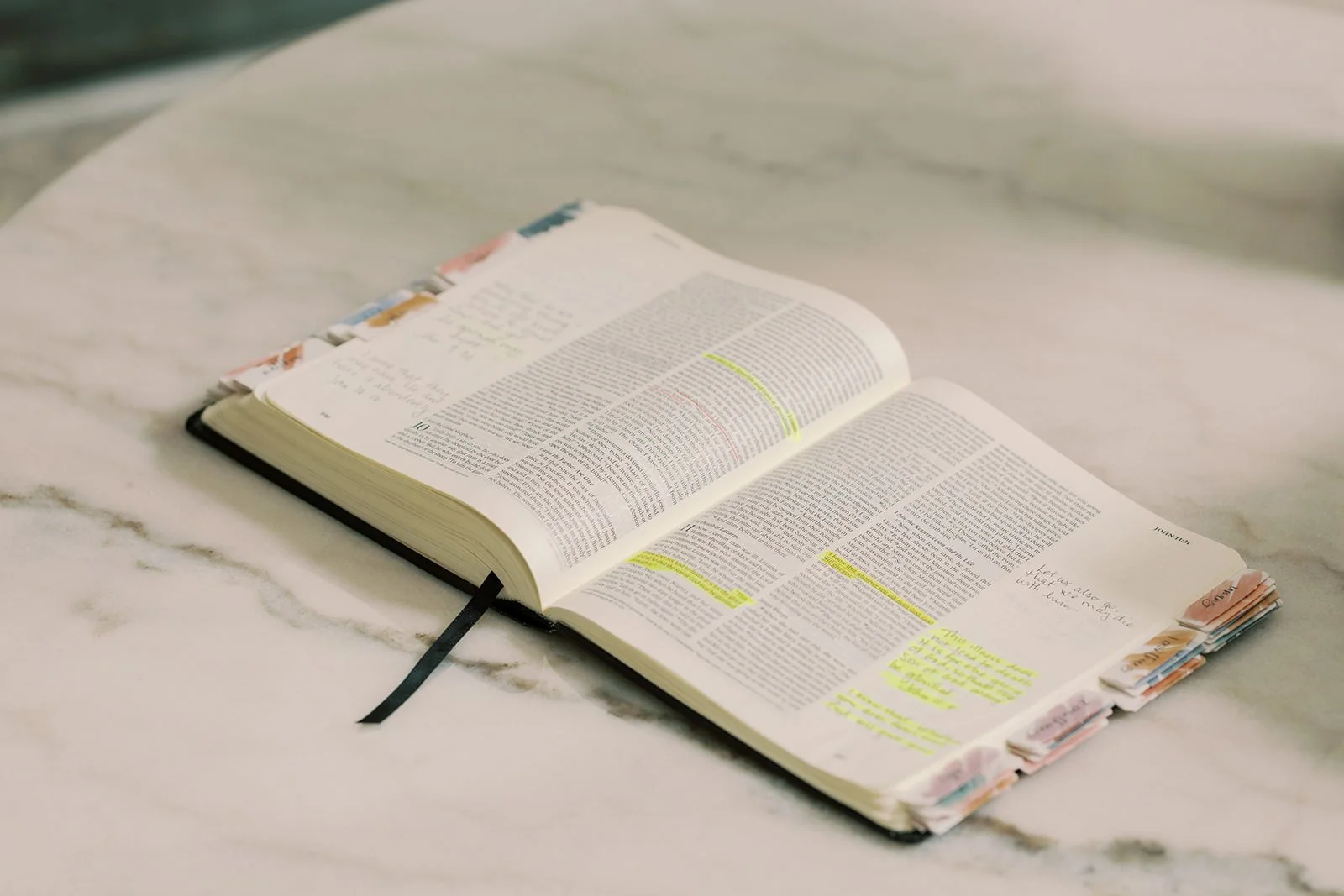 Open Bible on a marble table representing stewardship in financial planning, faith, and legacy