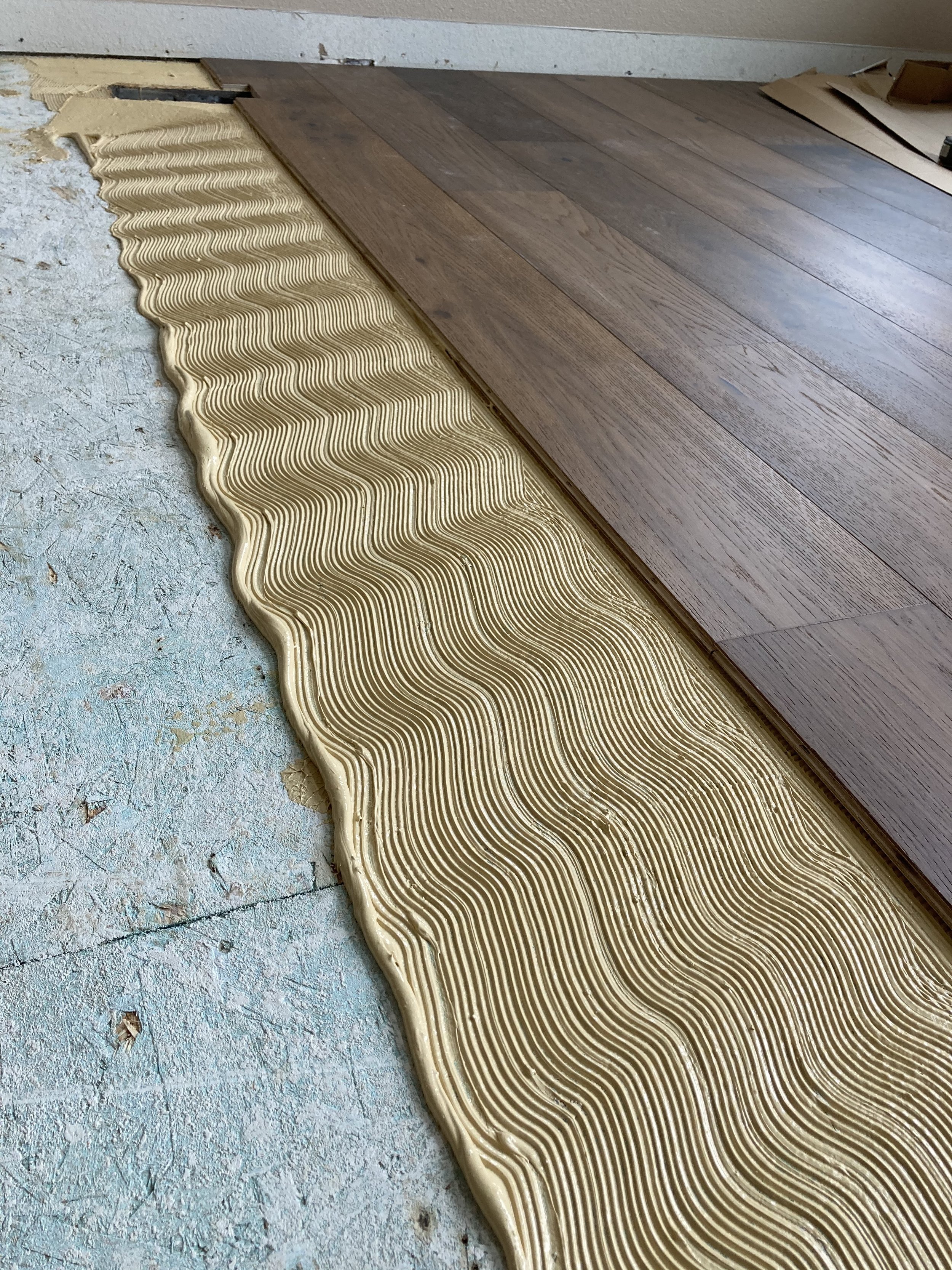 Prefinished solid hardwood installation with mitered stair nose