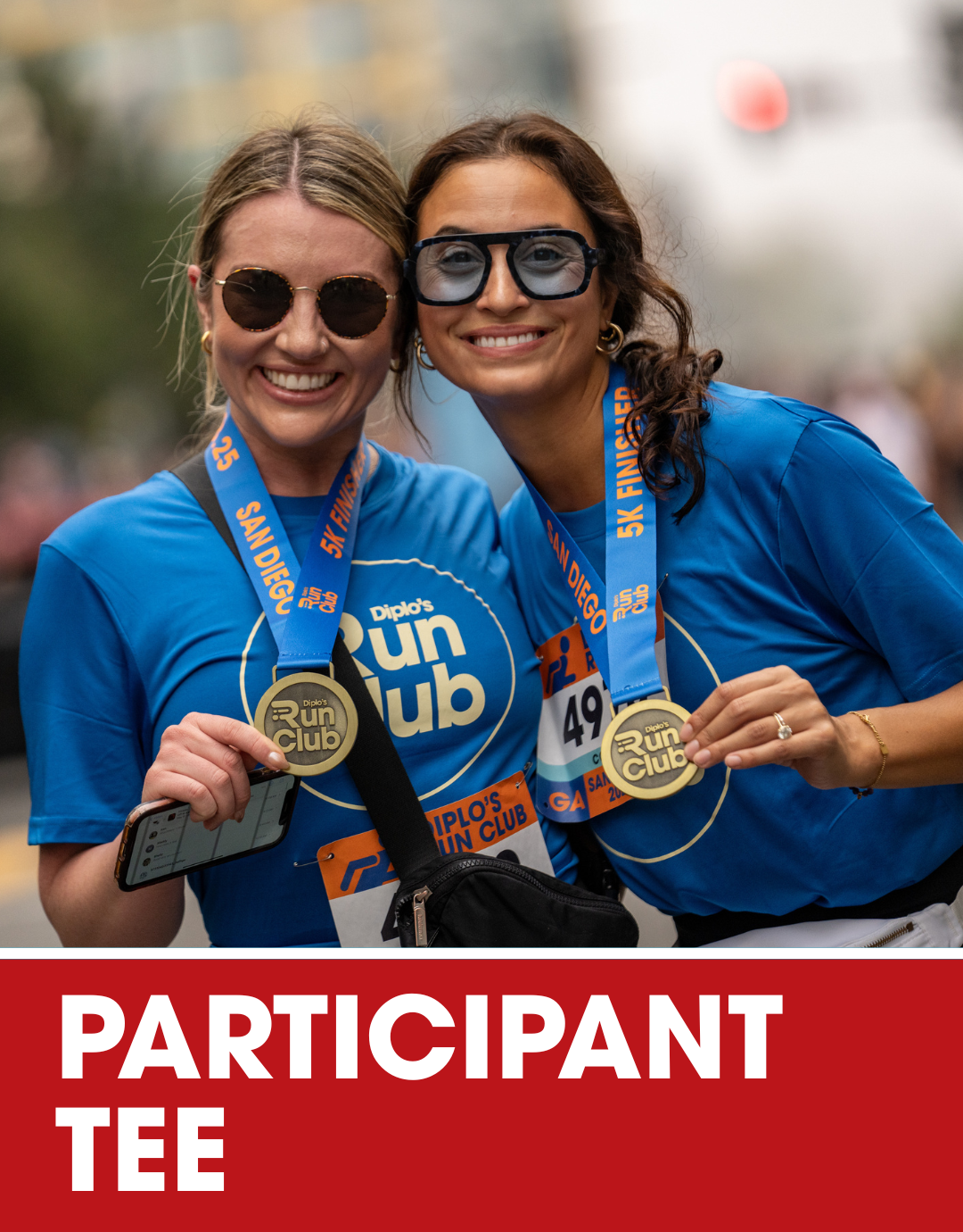 Blue T-shirt with logos for Diplo's Run Club on the front and back, displayed on a turquoise background with a label that reads PARTICIPANT TEE.