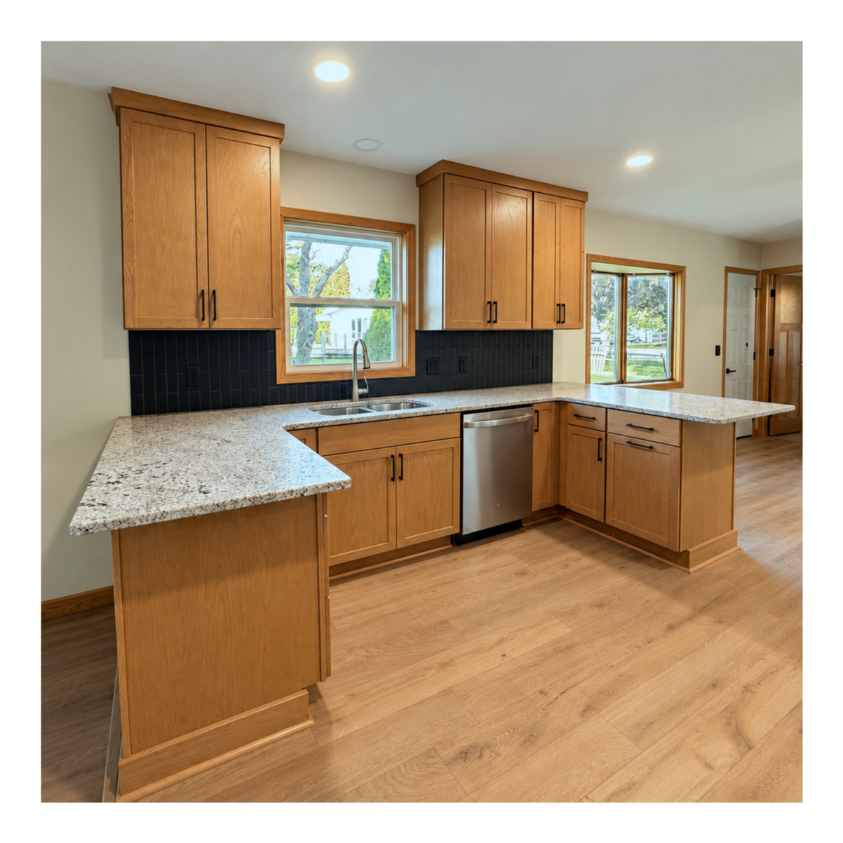 Leathered Granite, Black Daltile, on the clear oak, made this area so bright and modern. 