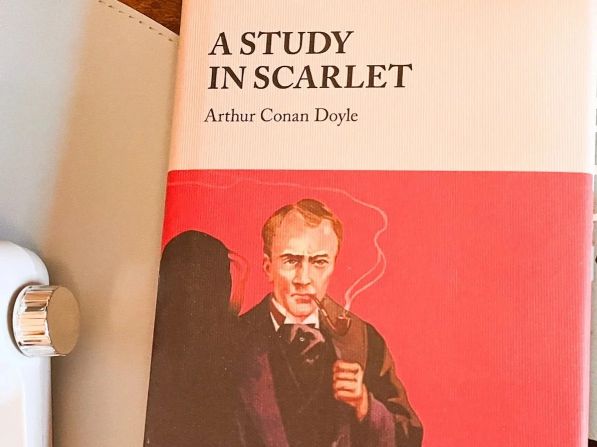 "A Study in Scarlet" by Arthur Conan Doyle book cover because we are reading this book in our book club in September.