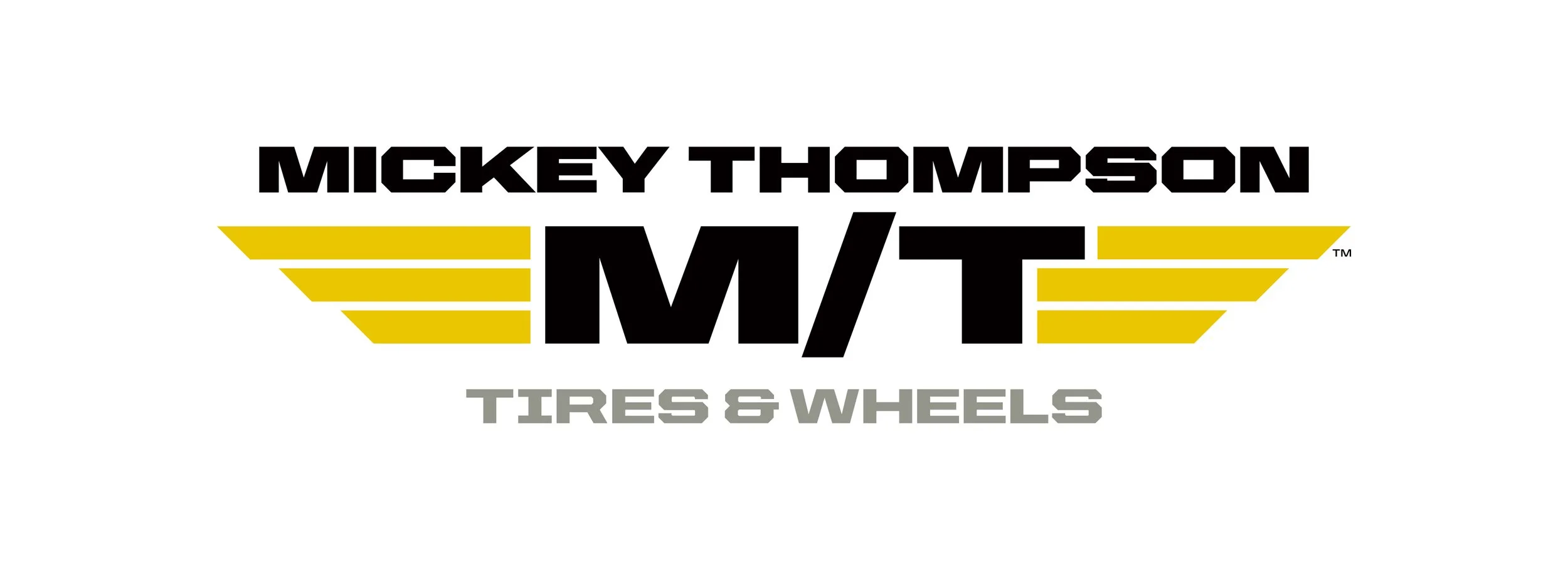 Logo for Mickey Thompson Tires & Wheels with yellow wing-like designs on each side.