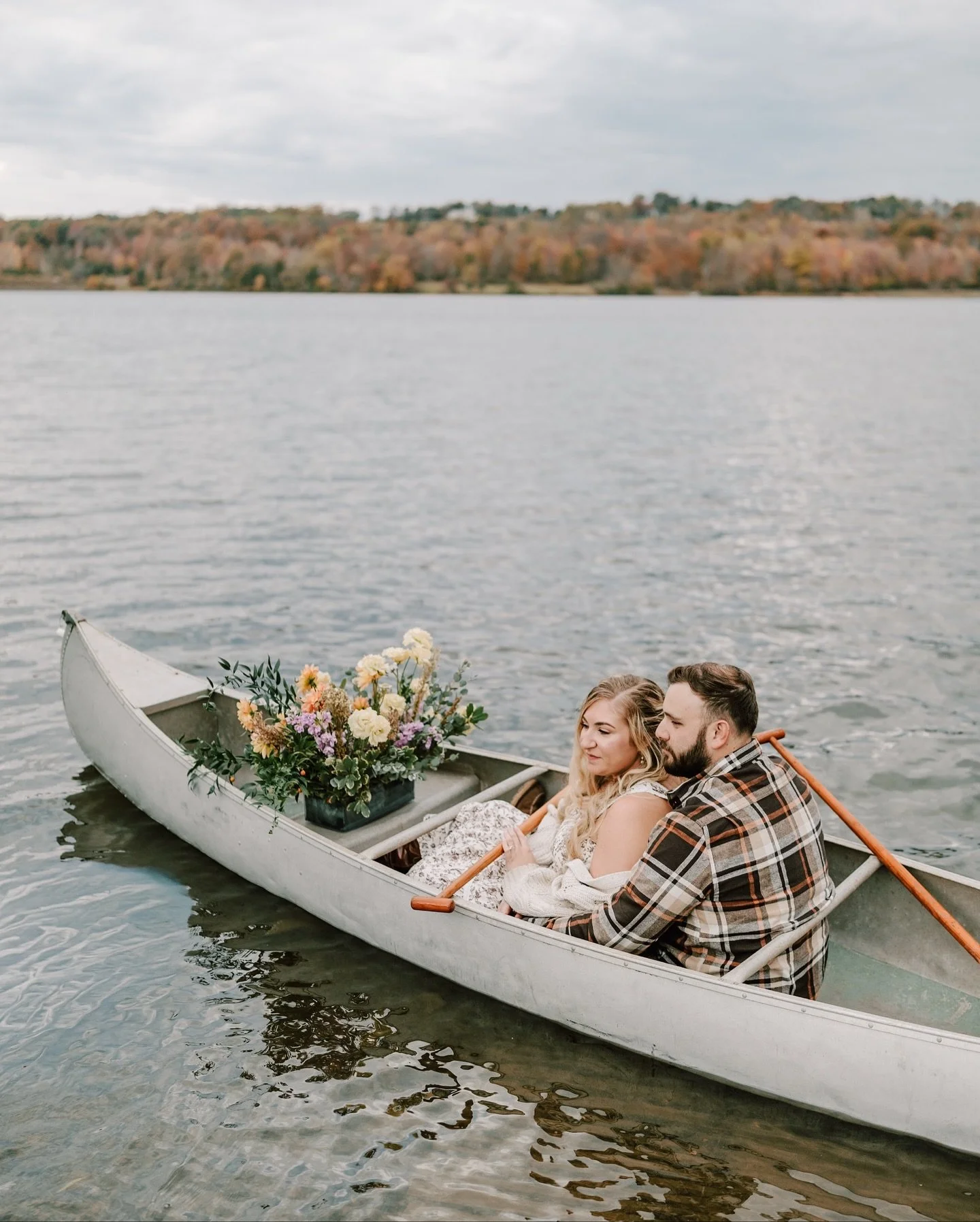 There&rsquo;s just something magical about fall at Peace Valley Park, with golden trees, crisp air, and Christa + Matt together in a canoe full of flowers drifting across the water.

They brought all the cozy vibes for their engagement session, compl