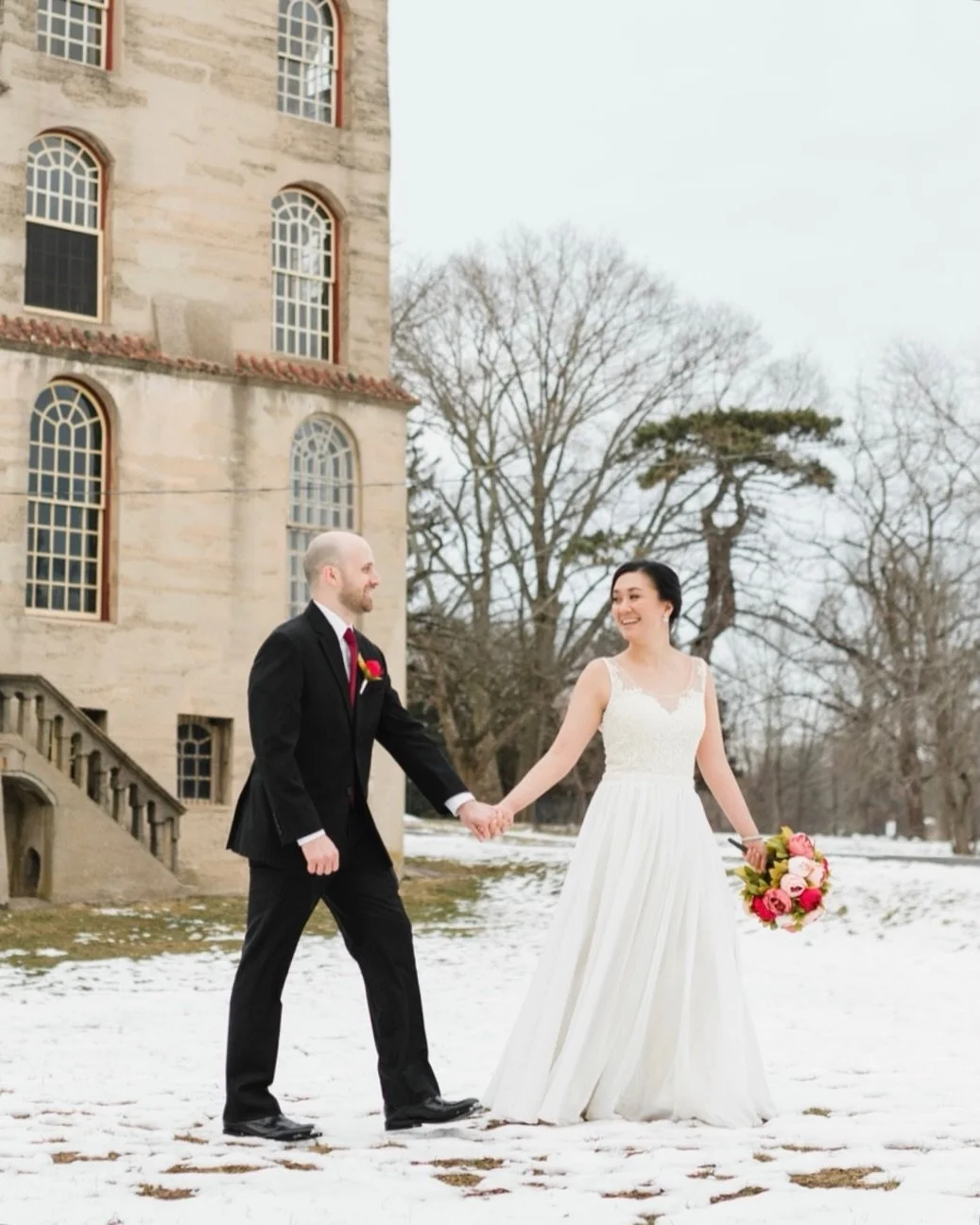 It&rsquo;s snowing here today and I immediately thought of this moment. Crisp air, quiet grounds, and two people walking hand in hand while the world felt a little slower. No rushing, no stress, just being together in it.

Winter weddings have this c
