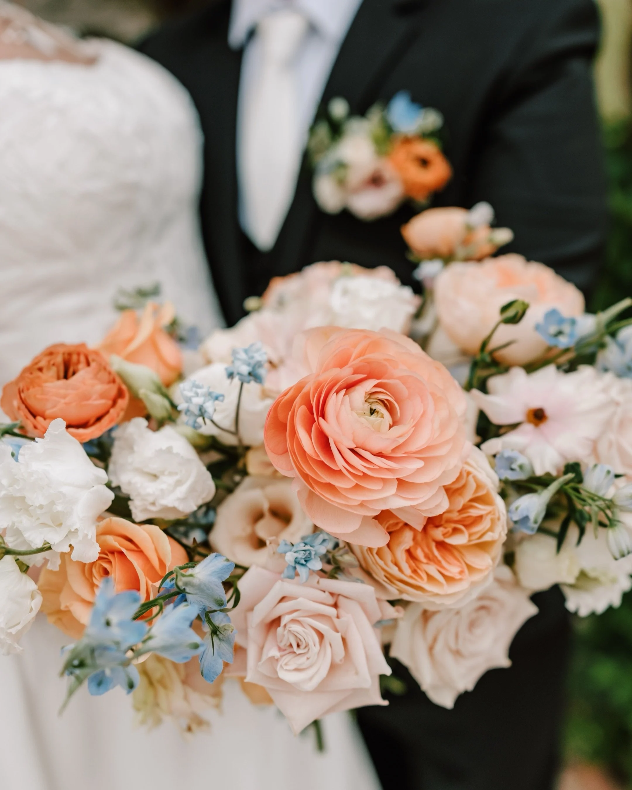 Lauren and Chris were not letting the rain win. It poured almost the entire day, but they fully embraced it and somehow made it feel kind of magical.

We snuck outside for their first look and a few portraits before it really came down, and those end