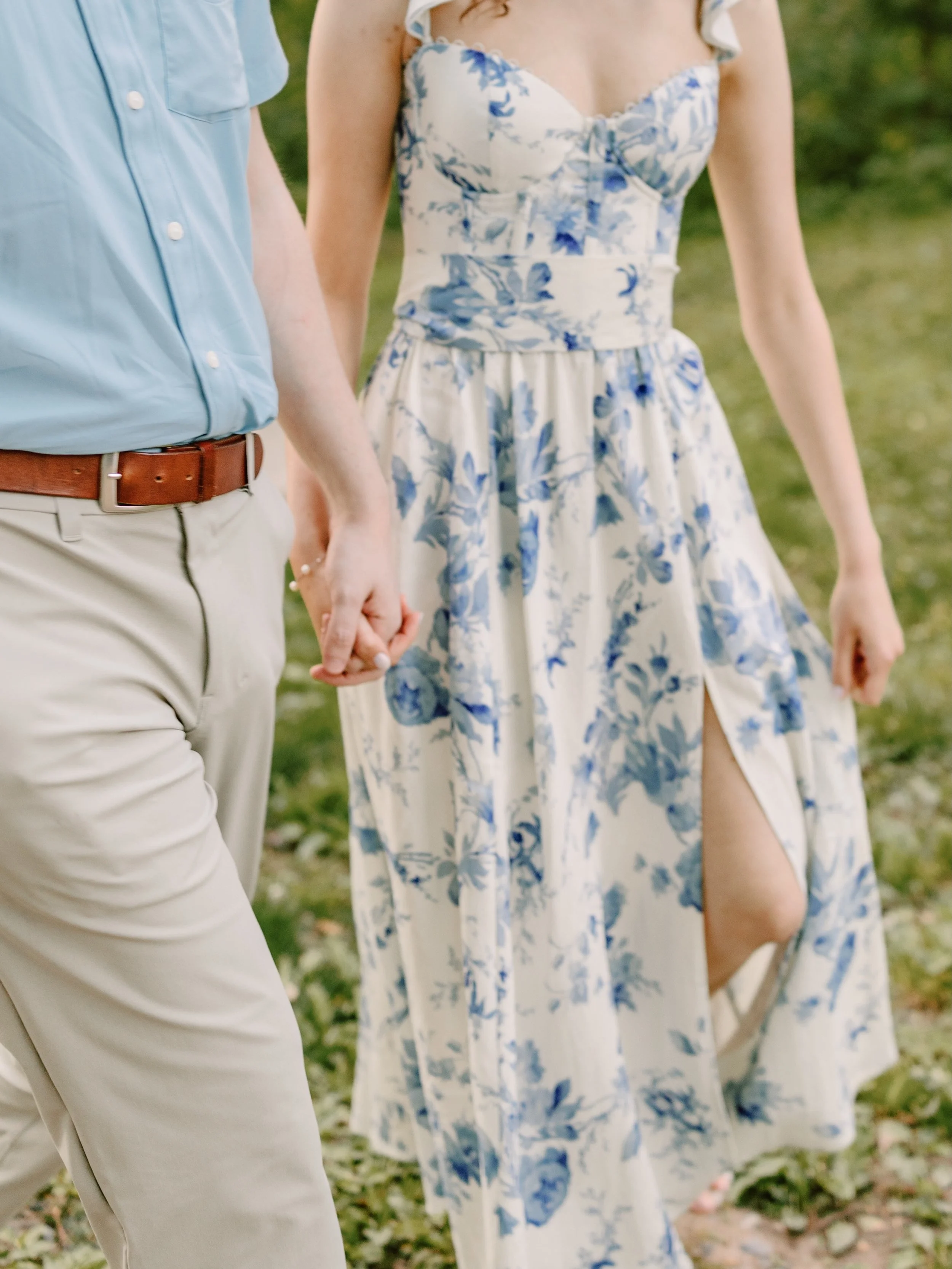 Olivia + Sean wandering through New Hope, PA and crossing over into Lambertville, NJ for an engagement session that felt like the perfect mix of sweet little in between moments and summer light. 🤍 Blue floral dress, riverside views, hidden greenery,