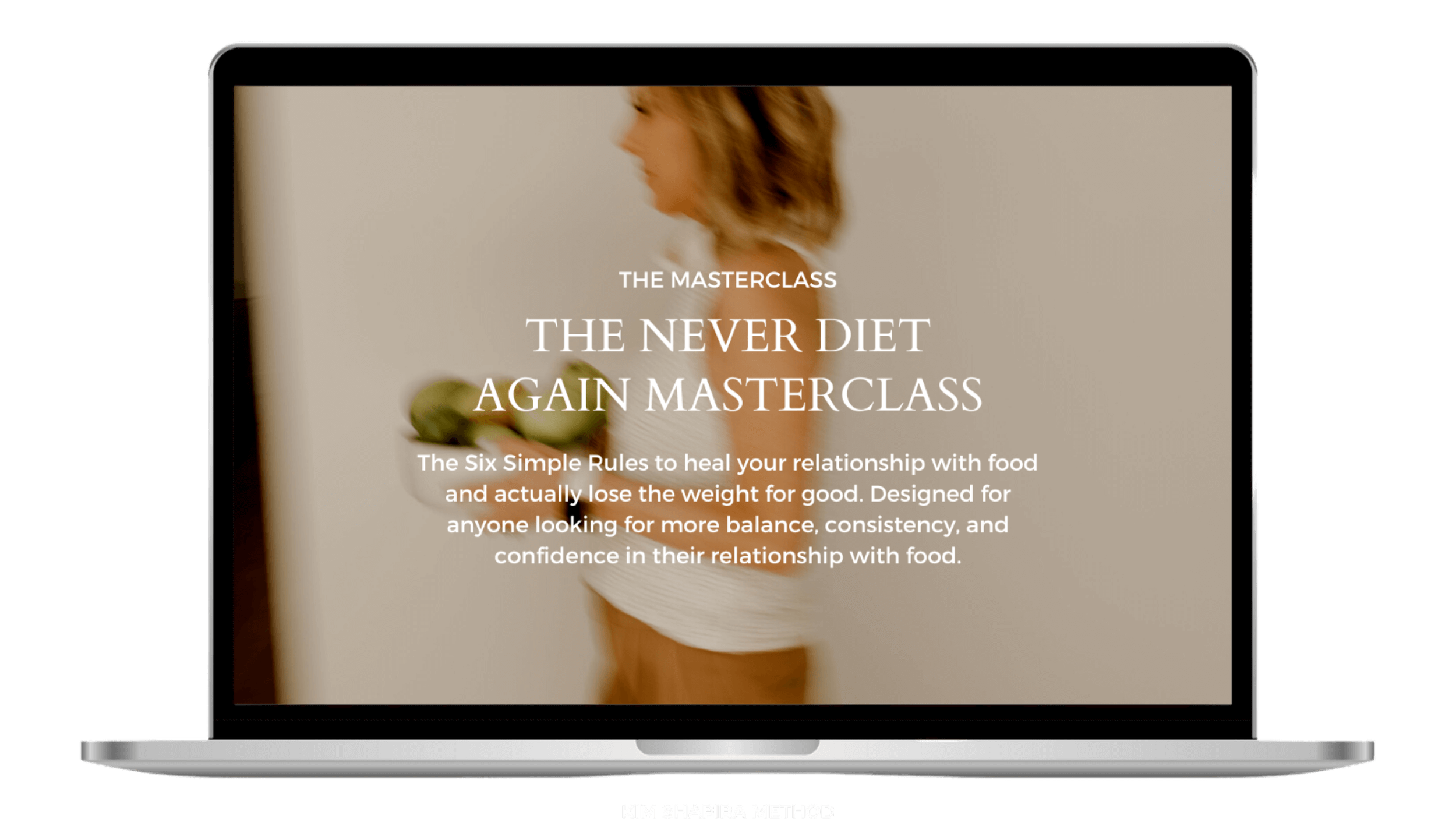 Laptop screen displaying a blurred image of a woman holding green apples, with text about a Kim Shapira's masterclass on dieting and relationship with food.