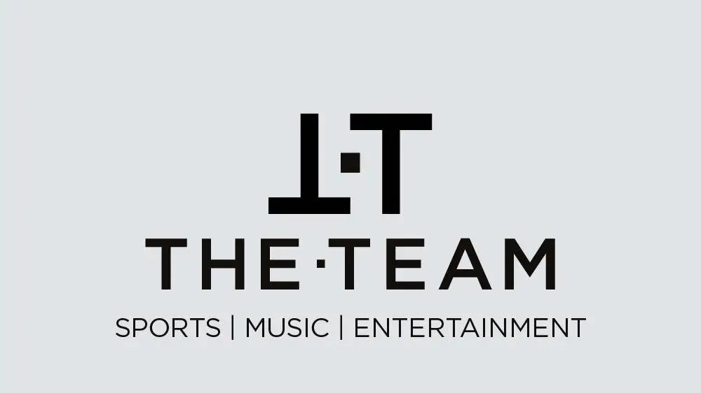 Logo for 'It The Team' featuring stylized 'T T' with 'It The Team' written below, and the words 'Sports | Music | Entertainment' underneath.
