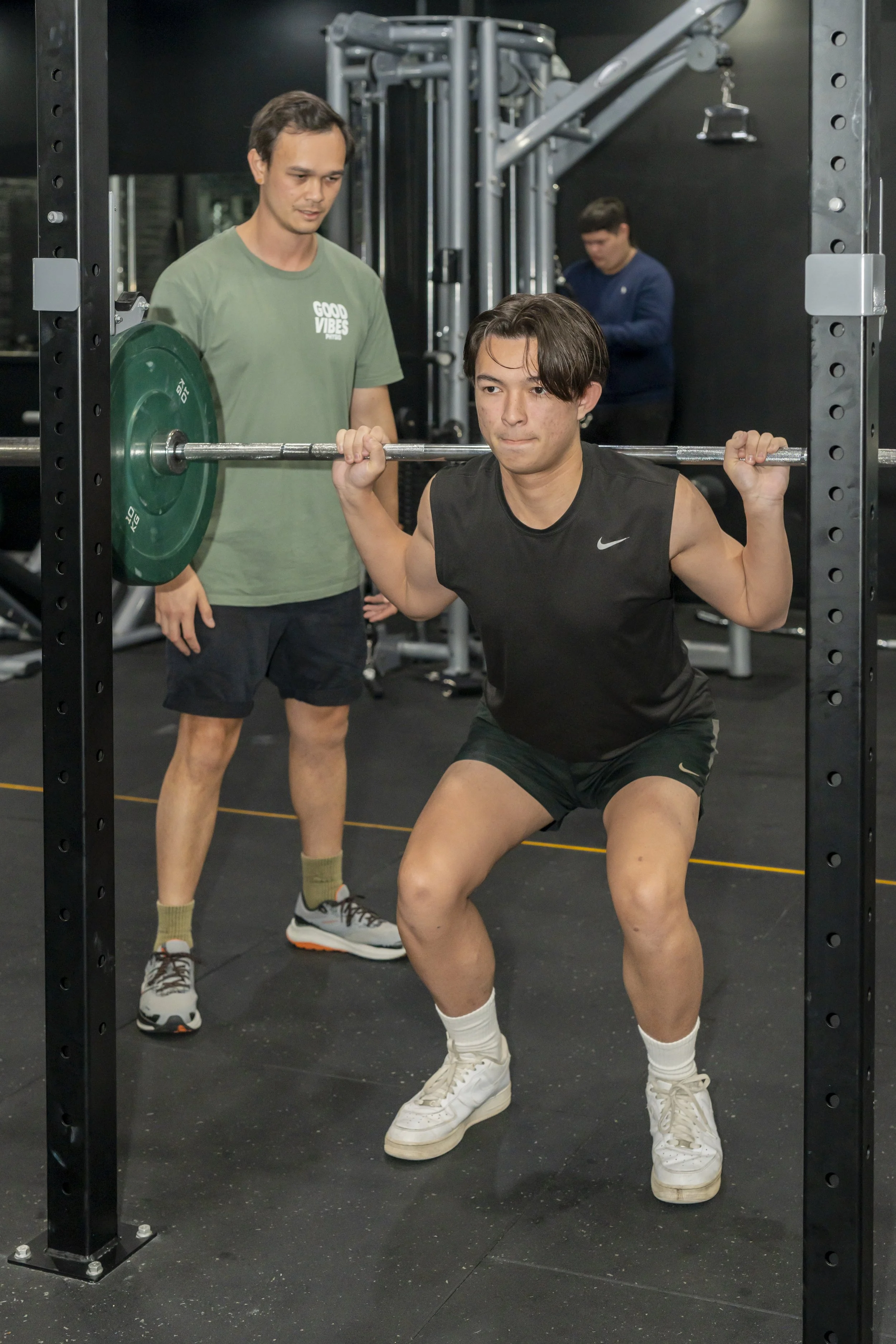 Chee, our physio at Good Vibes Physio is  guiding a client with his exercise