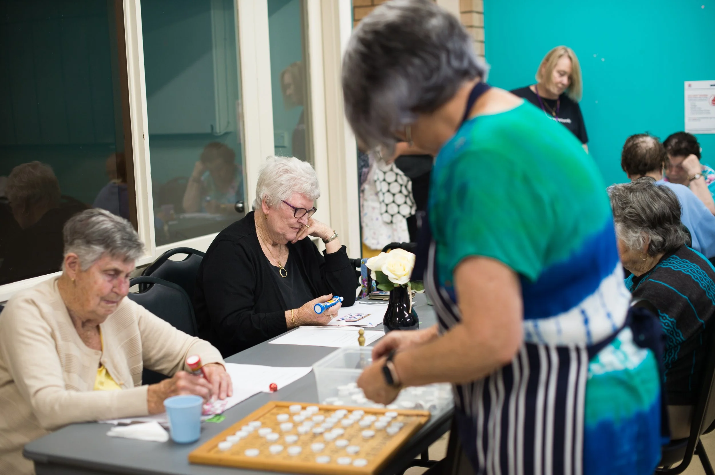Blacktown Meals on Wheels volunteer facilitating a bingo game