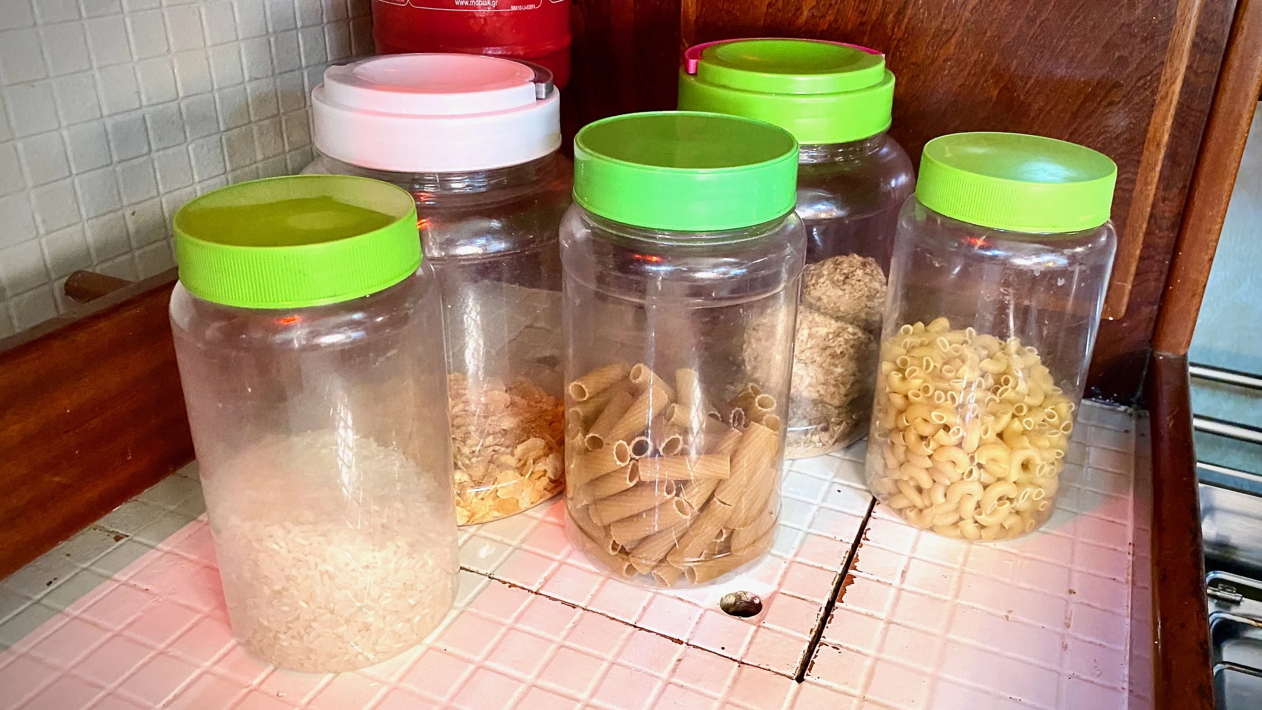 Plastic containers of pasta, rice and cereal on S/V Mothership