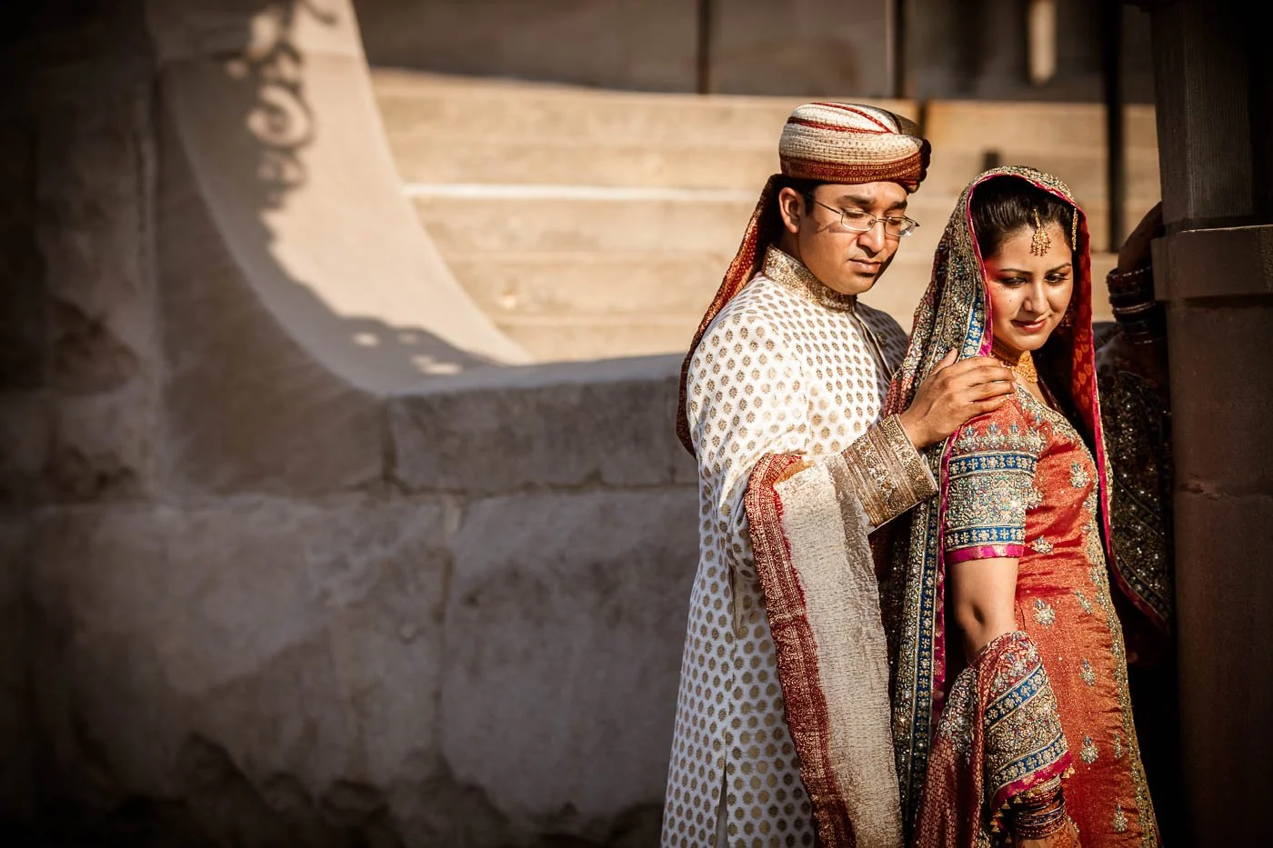 Pakistani couple posing against wall at St Louis Muslim wedding Rukhsati