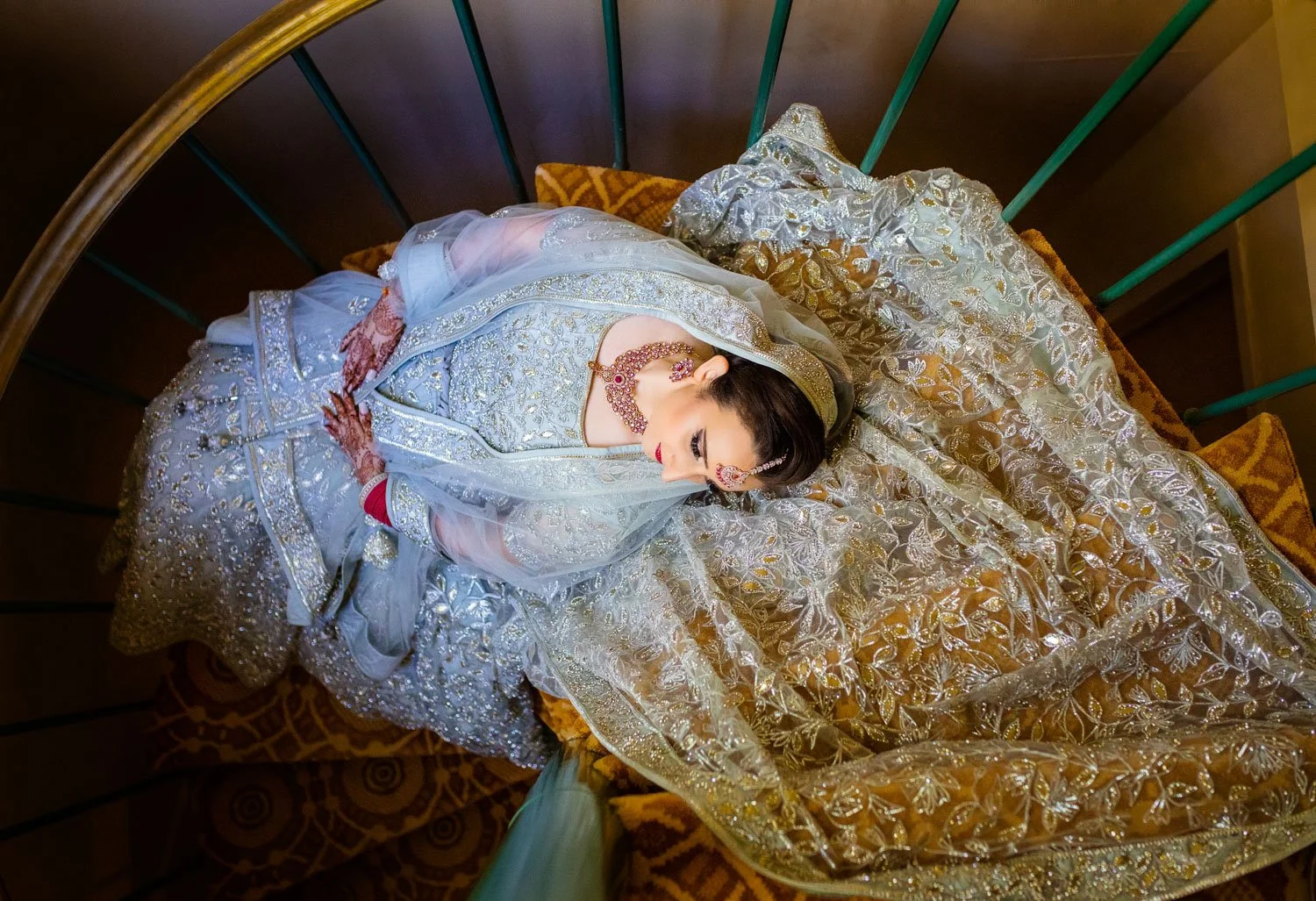 Bridal portrait lying on staircase in Westfields Marriott Washington