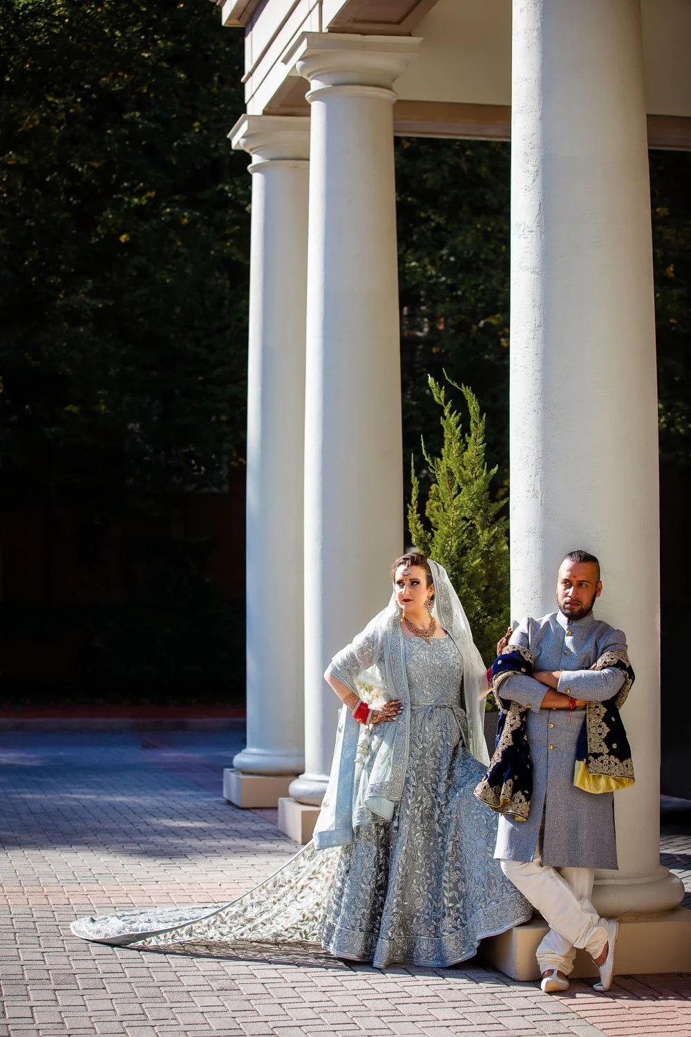 Bride and groom leaning against pillar outside Westfields hotel