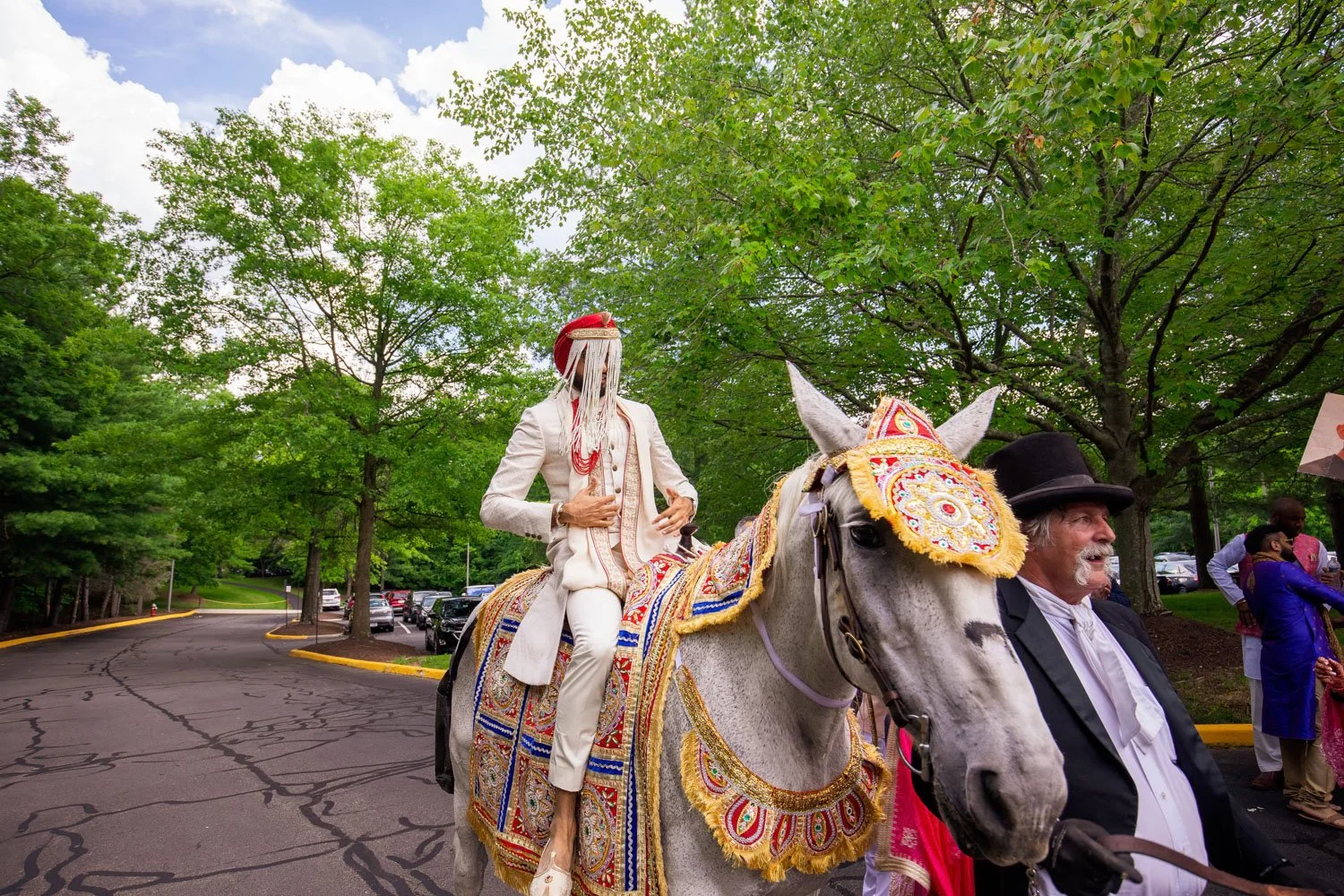 Groom coming in on a horse during the baraat at Westfields Marriott Virginia