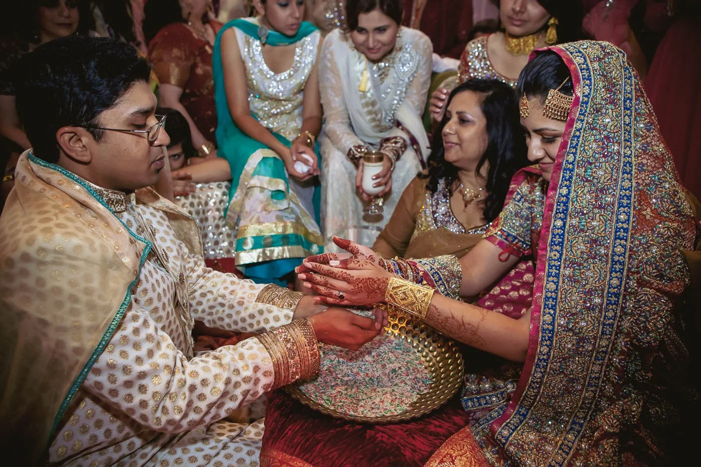 Bride and groom playing games during rukhsati at St Louis Union Station