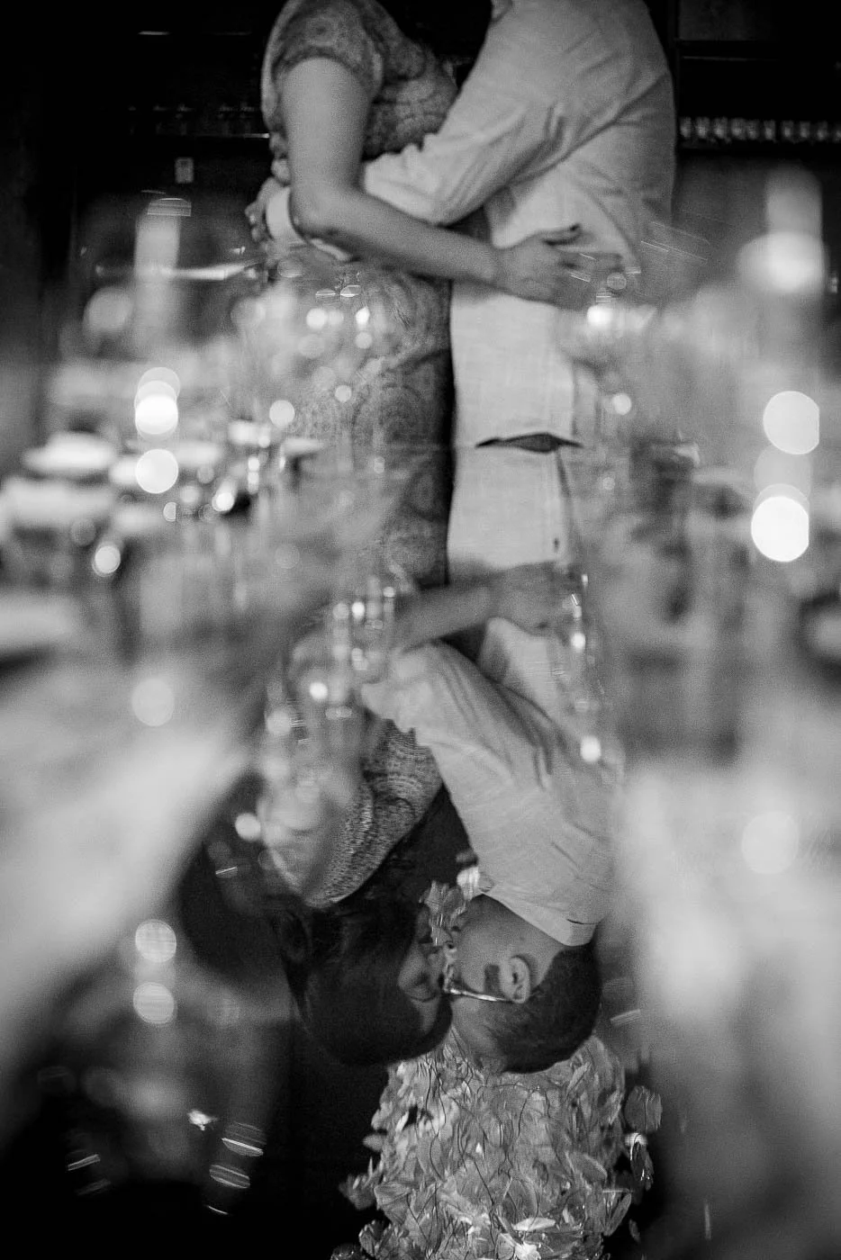 Bride and groom reflection on table at Embeya Chicago West Loop Engagement session by Rahul Rana