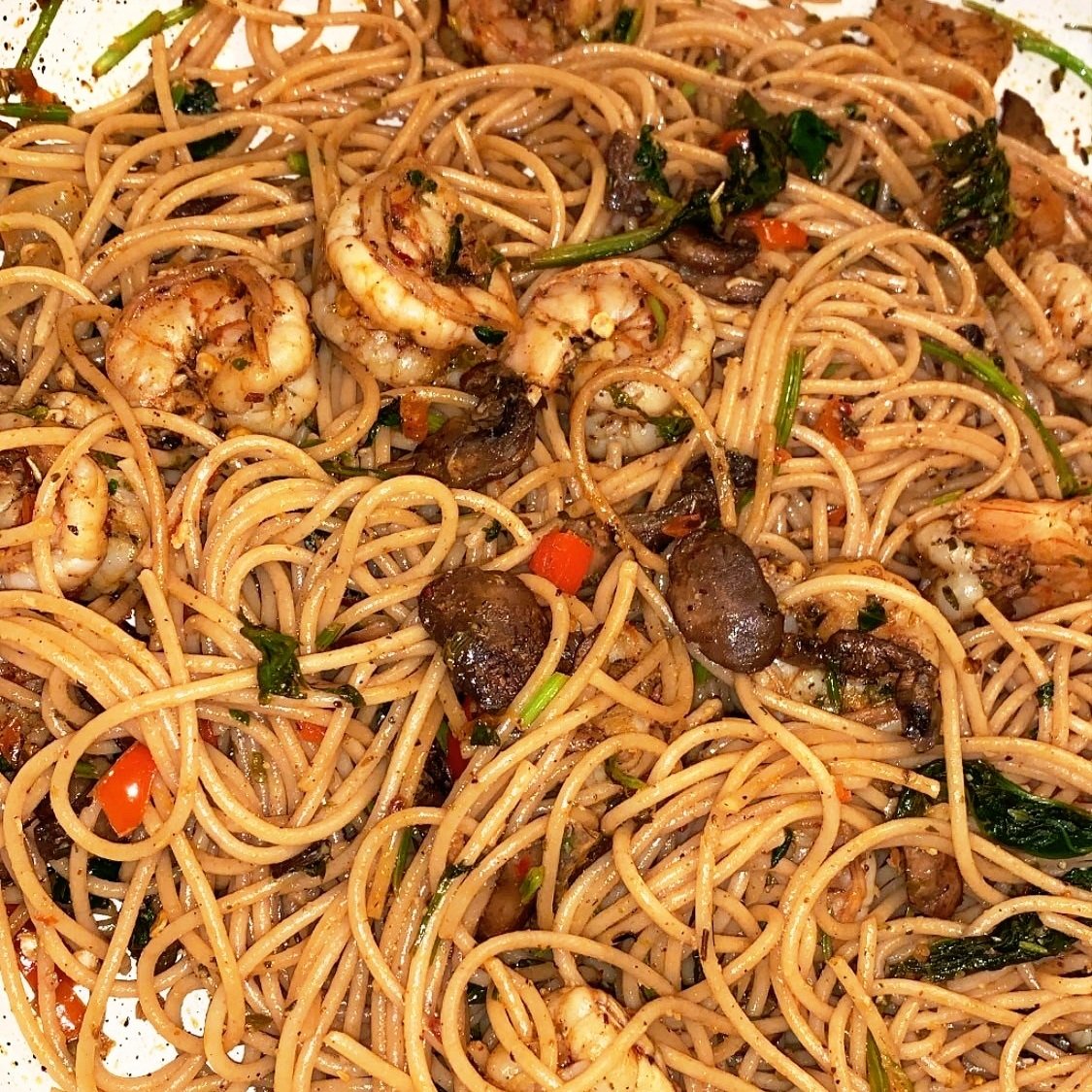 Shrimp scampi with mushrooms, bell pepper, green chili, garlic, cumin, coriander, red chili powder, Italian spices