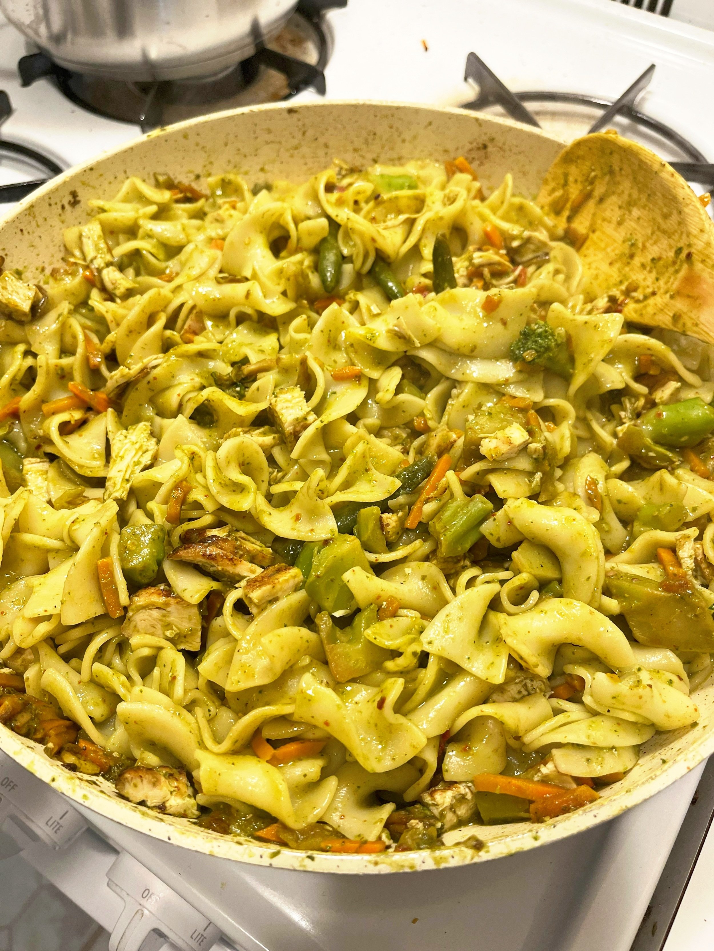 Basil pesto- almond flour, parmesan- with lemon pepper marinated grilled chicken cooked with sautéed stir fry veggies