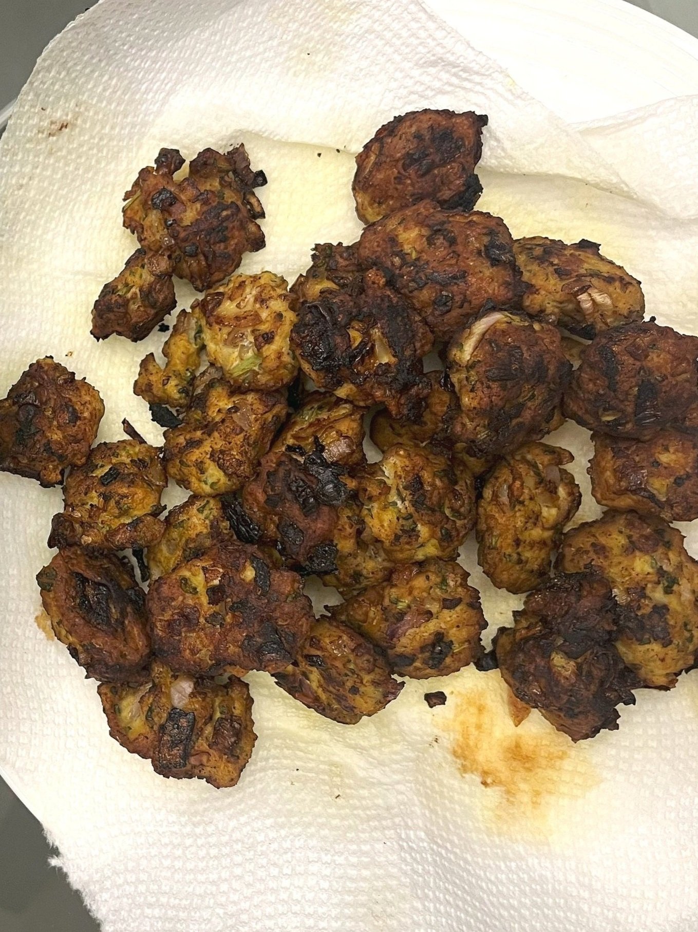 Ground chicken, minced red onion, mint, cilantro, tandoori spices, fried