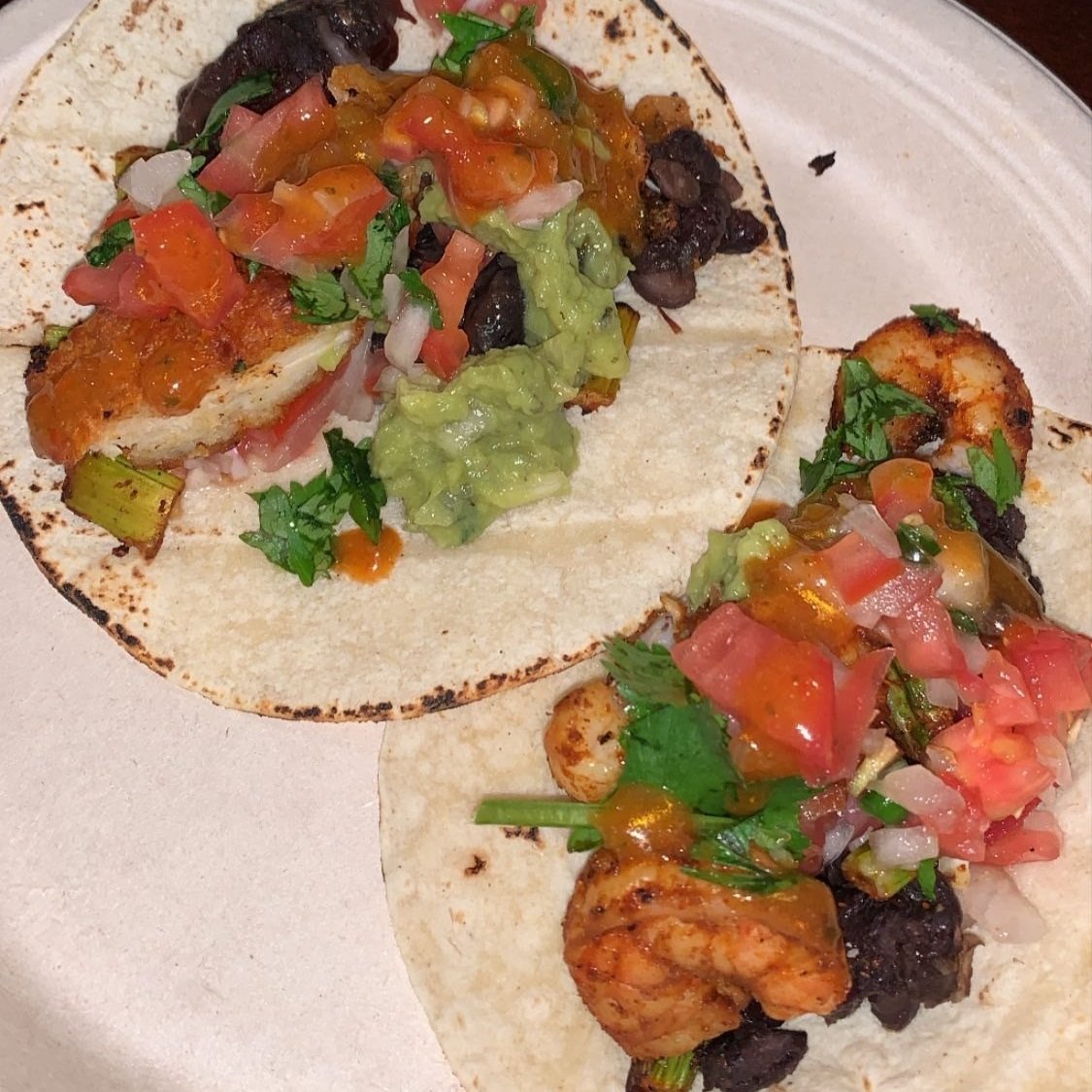 Chipotle chicken and spicy cilantro lime shrimp tacos