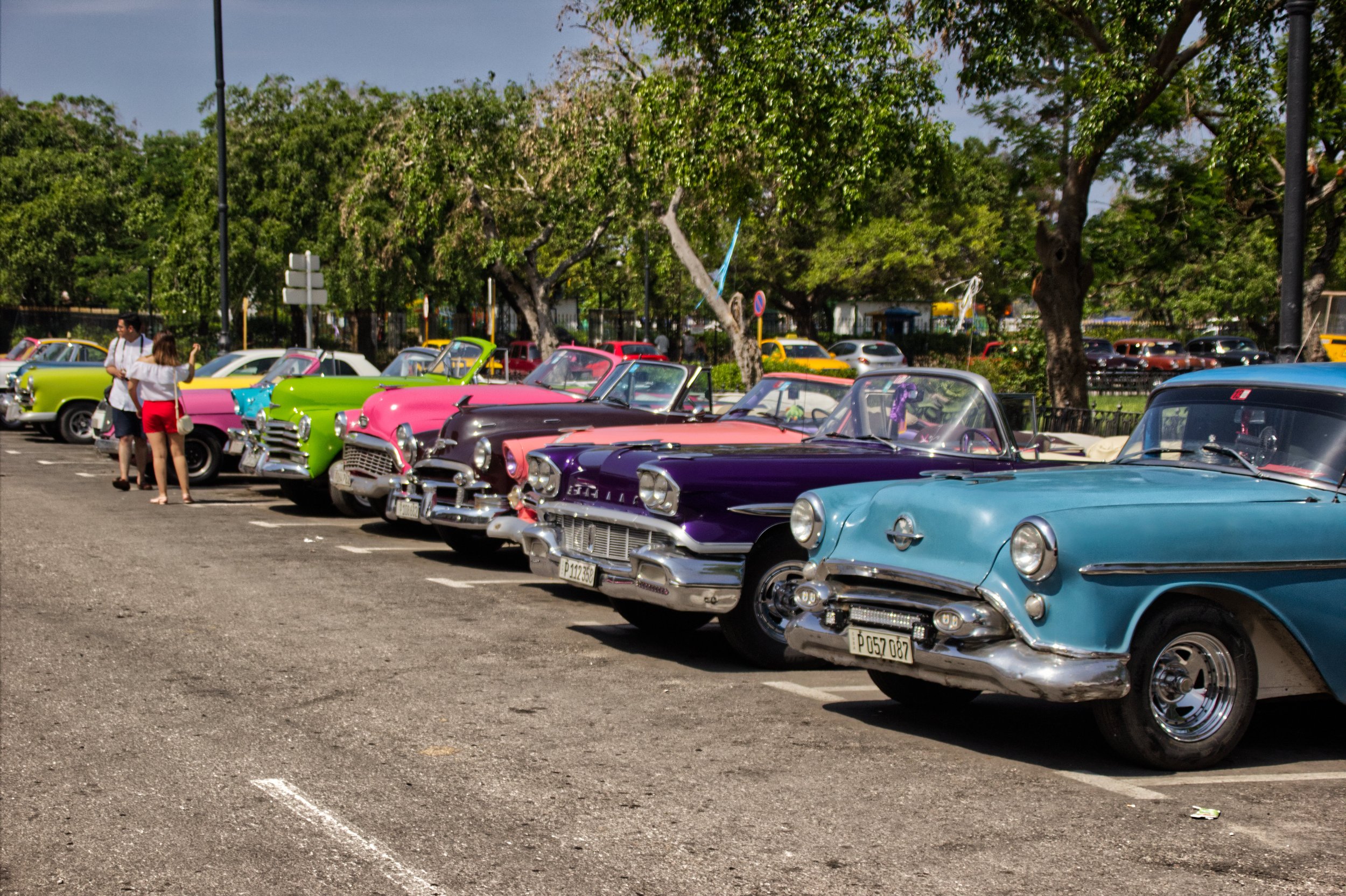 Classic American Convertibles parked along the Parque de la Maestranza, one of the spots to find them.| Credit: Reynaldo Cruz Diaz