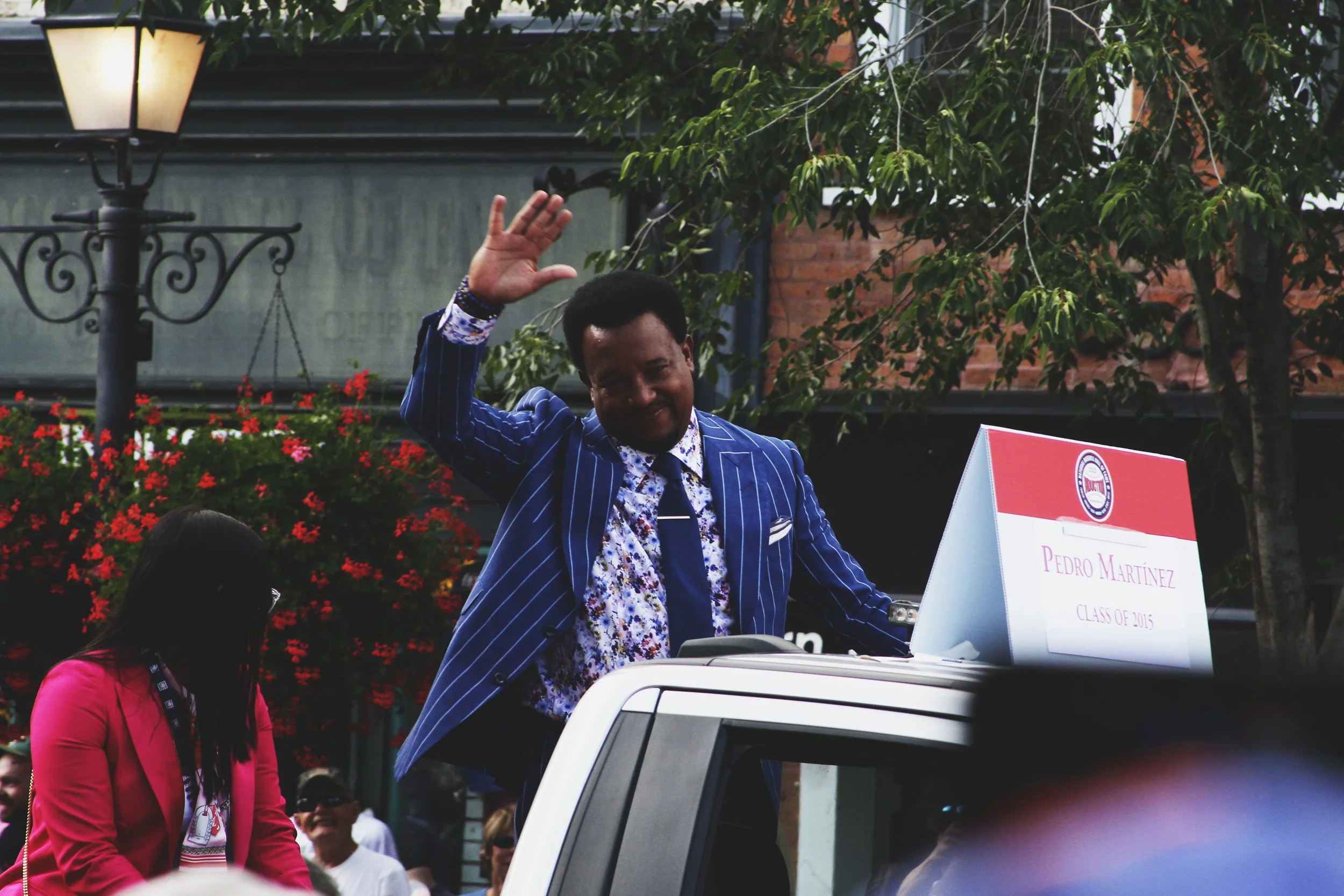 Hall of Famer Pedro Martínez acknowledges the crowd during the 2022 Hall of Fame Weekend parade.| Credit: Reynaldo Cruz Diaz