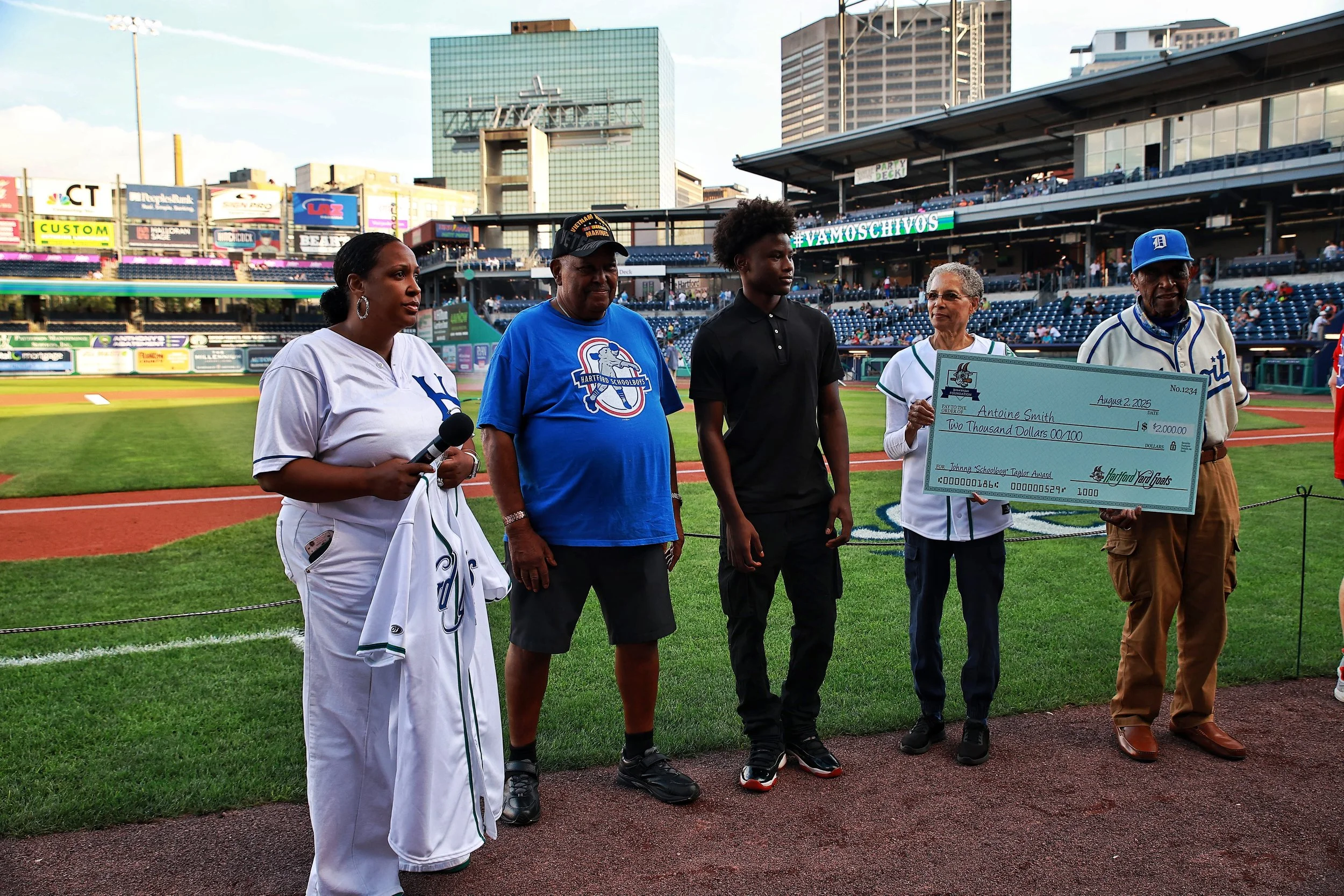 Aisha Petteway, John Taylor III, Antoine Smith, Lynette Taylor Grande and Pedro Sierra stand together prior to the game of Cuban Heritage Night.| Credit: Reynaldo Cruz Diaz